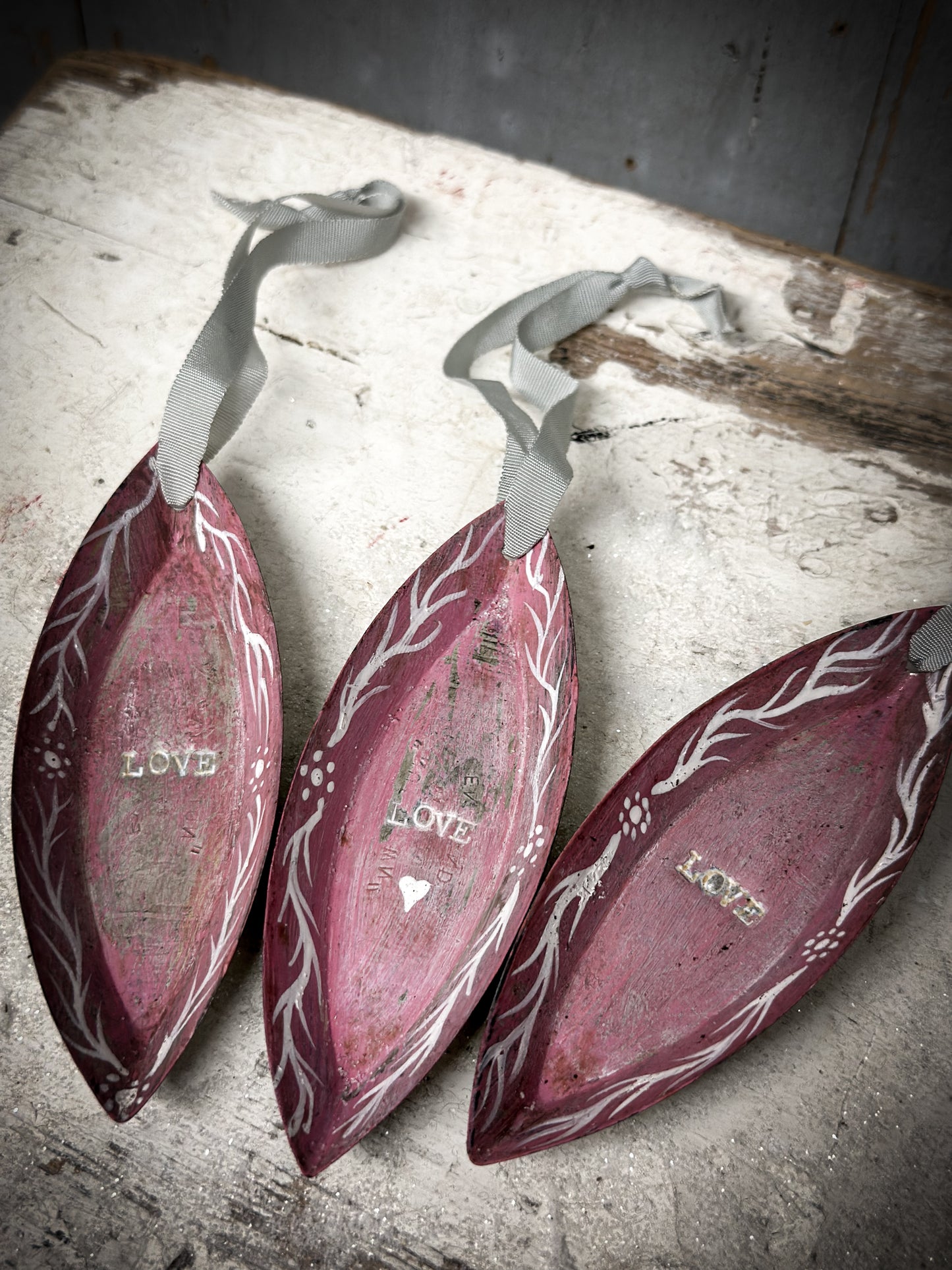 A Reworked French Patisserie Tin Christmas Decoration Stamped and Painted “love”