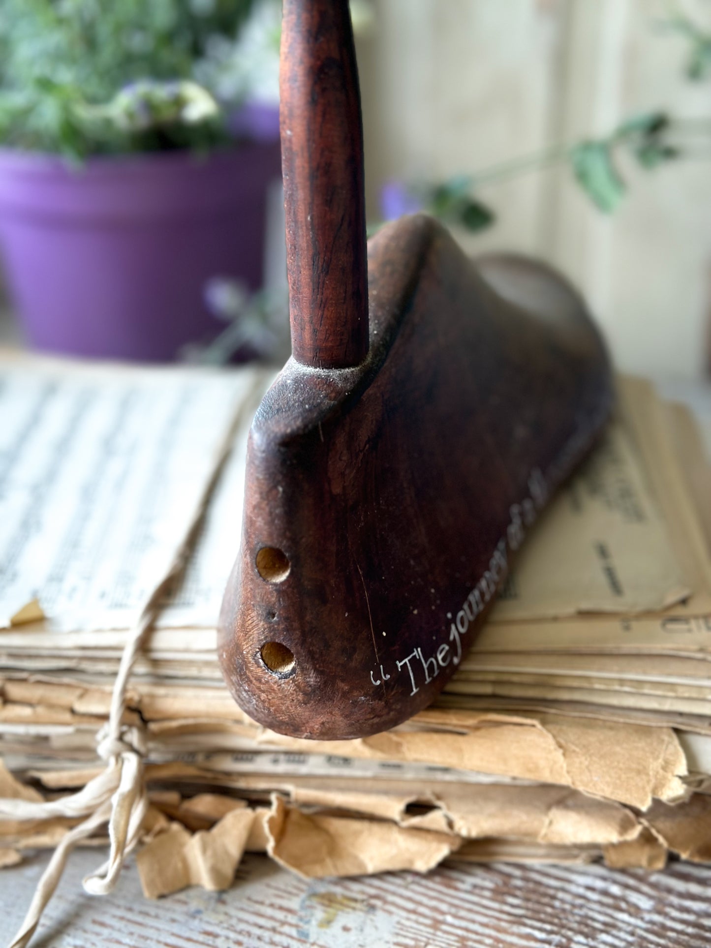 An antique wooden painted adult’s shoe last.