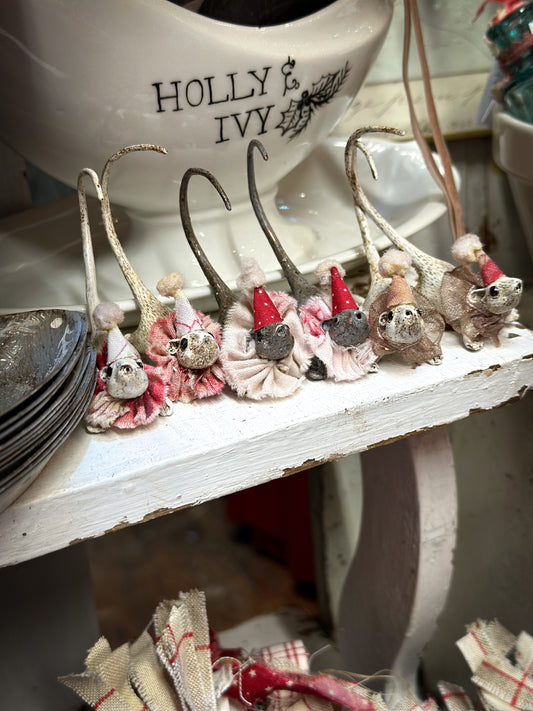 A cold painted brass “night before Christmas mouse” with a fabric ruffle and Christmas hat