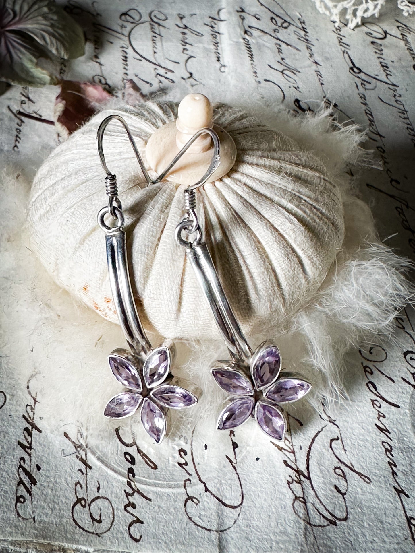 A pair of vintage silver amethyst flower drop earrings