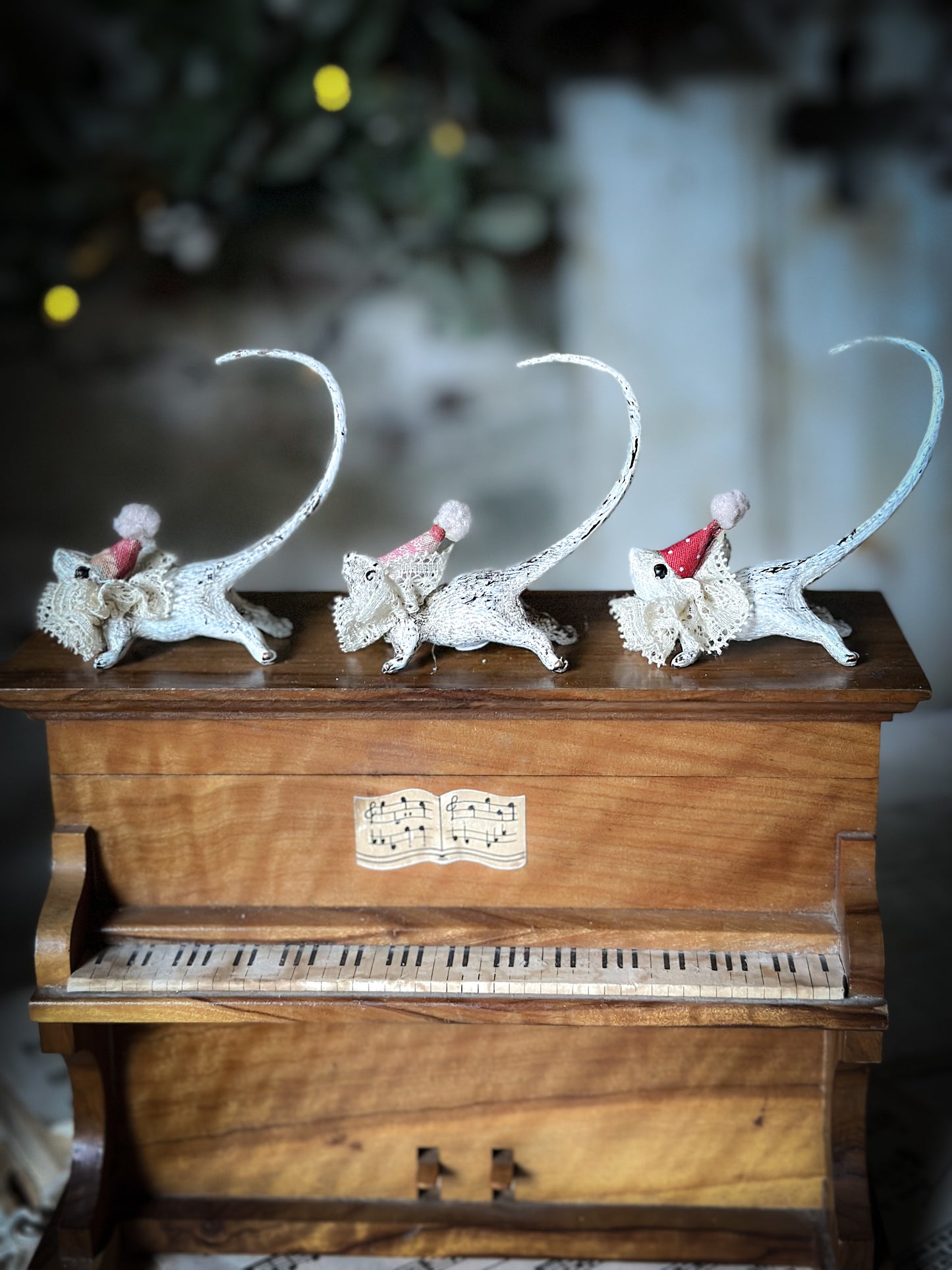 A cold painted brass “night before Christmas mouse” with a lace ruffle and Christmas hat