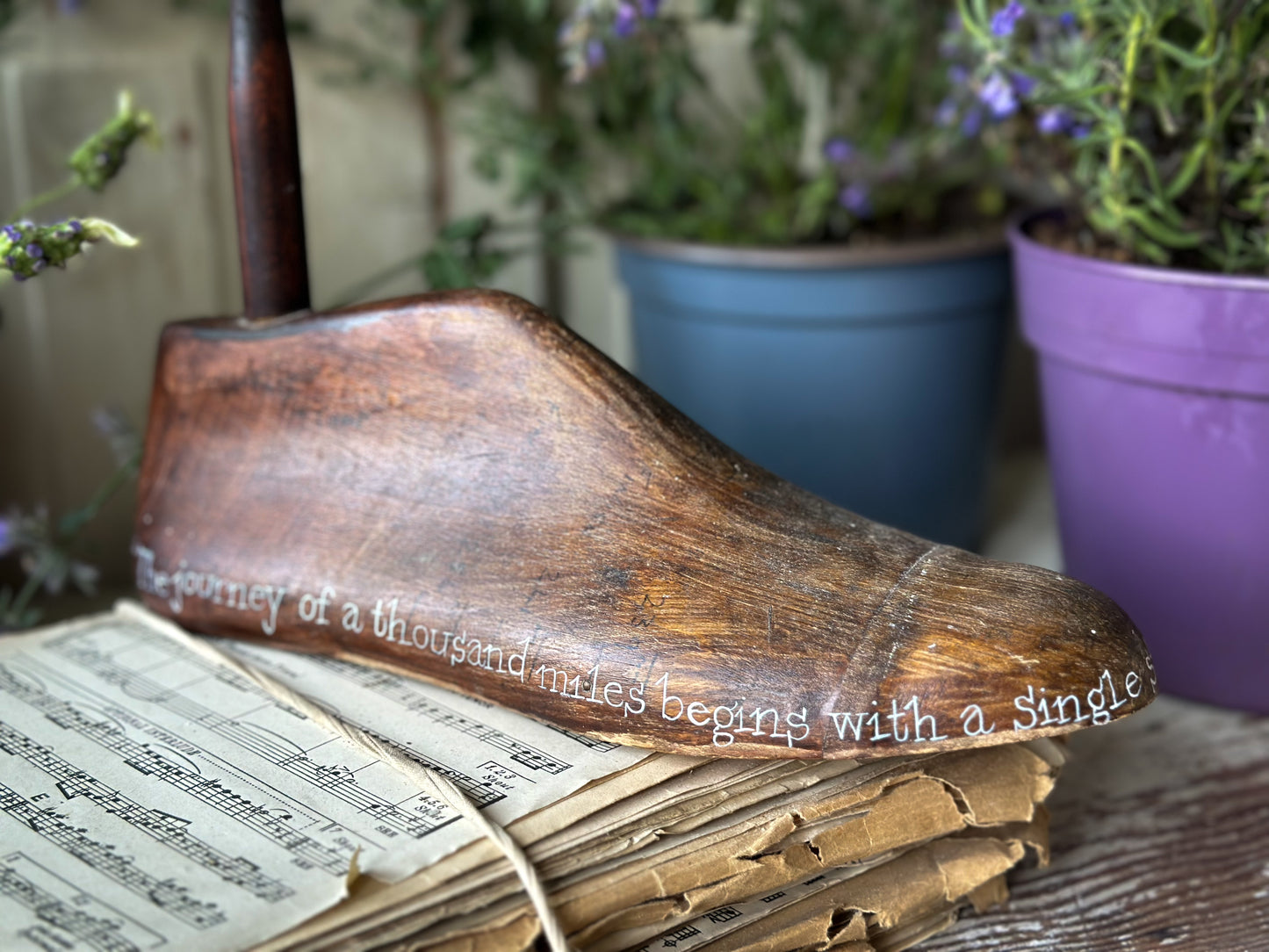 An antique wooden painted adult’s shoe last.