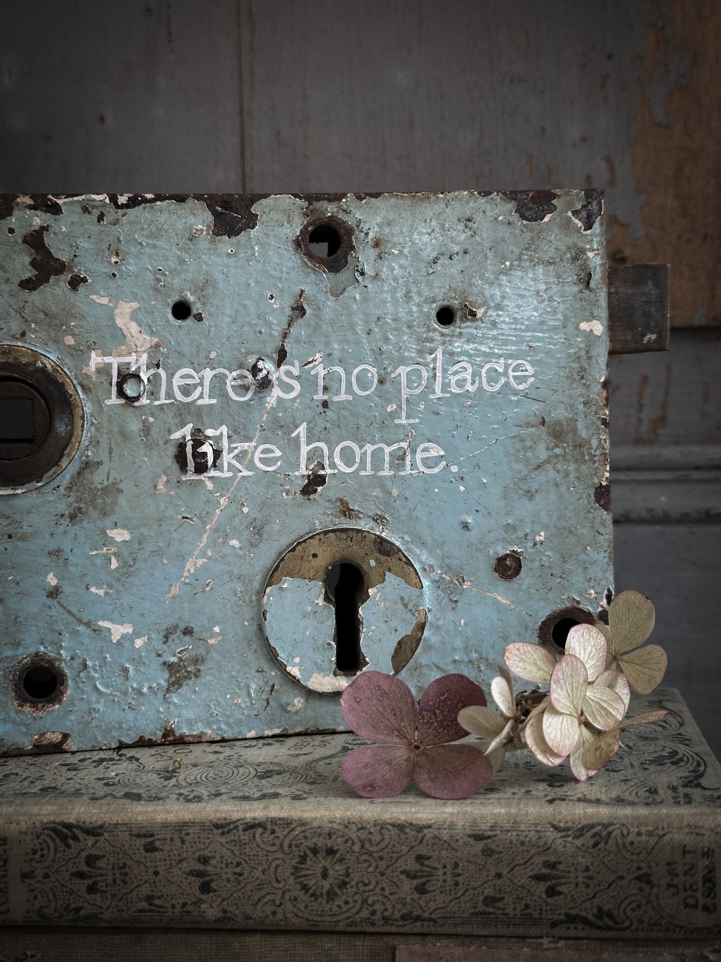 An Antique Lock With Hand Painted Quote