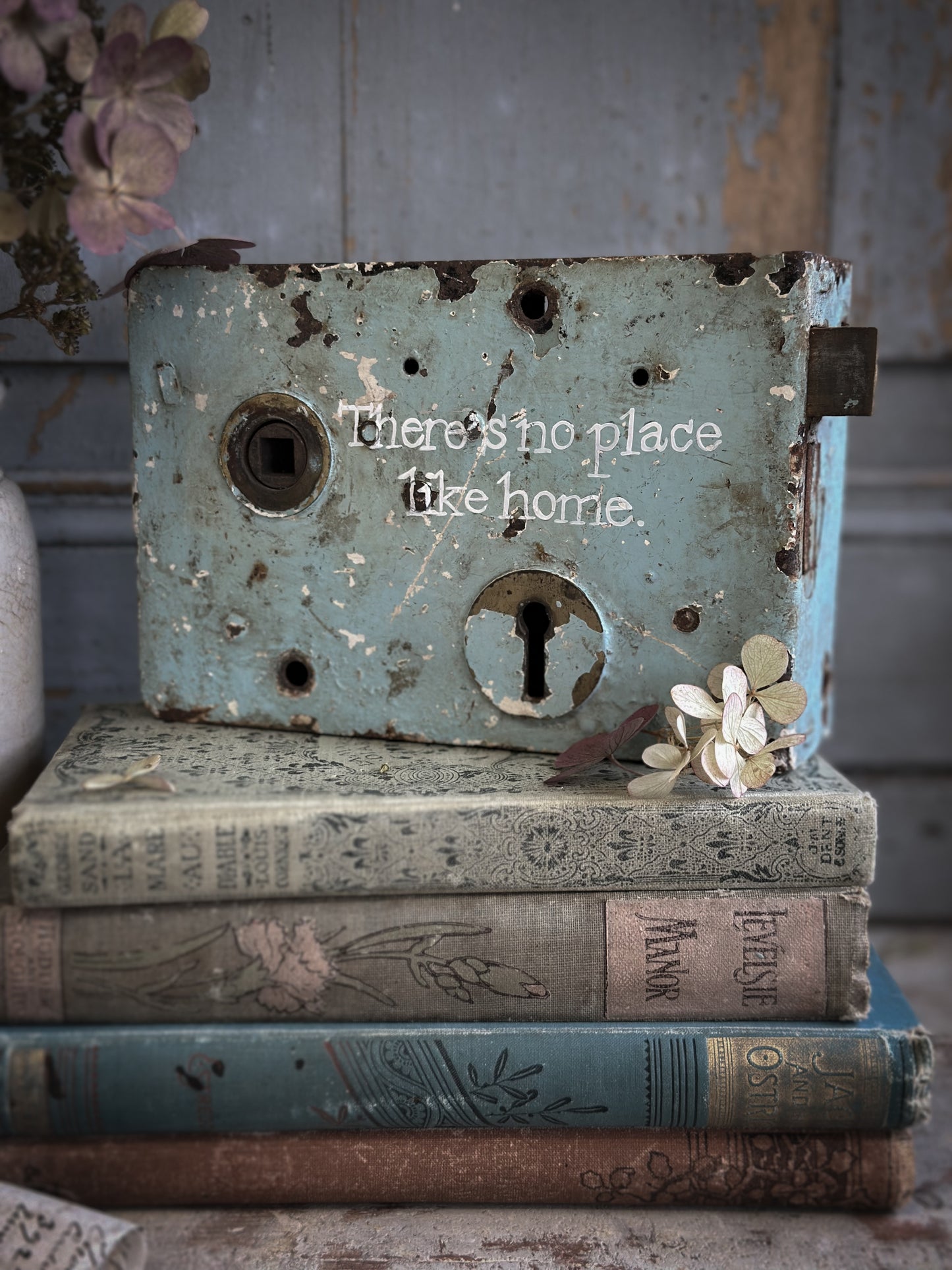 An Antique Lock With Hand Painted Quote