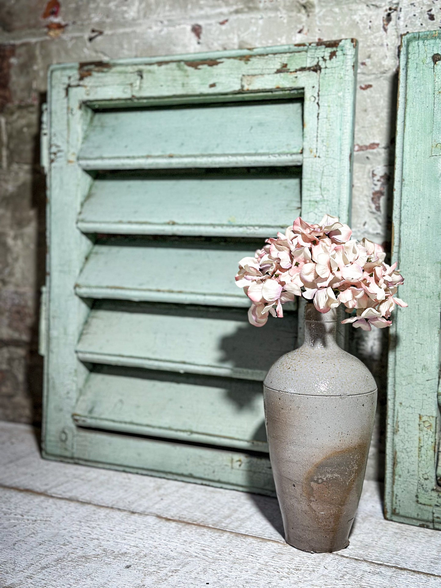 A Pair of French Green Chippy Painted Shutters