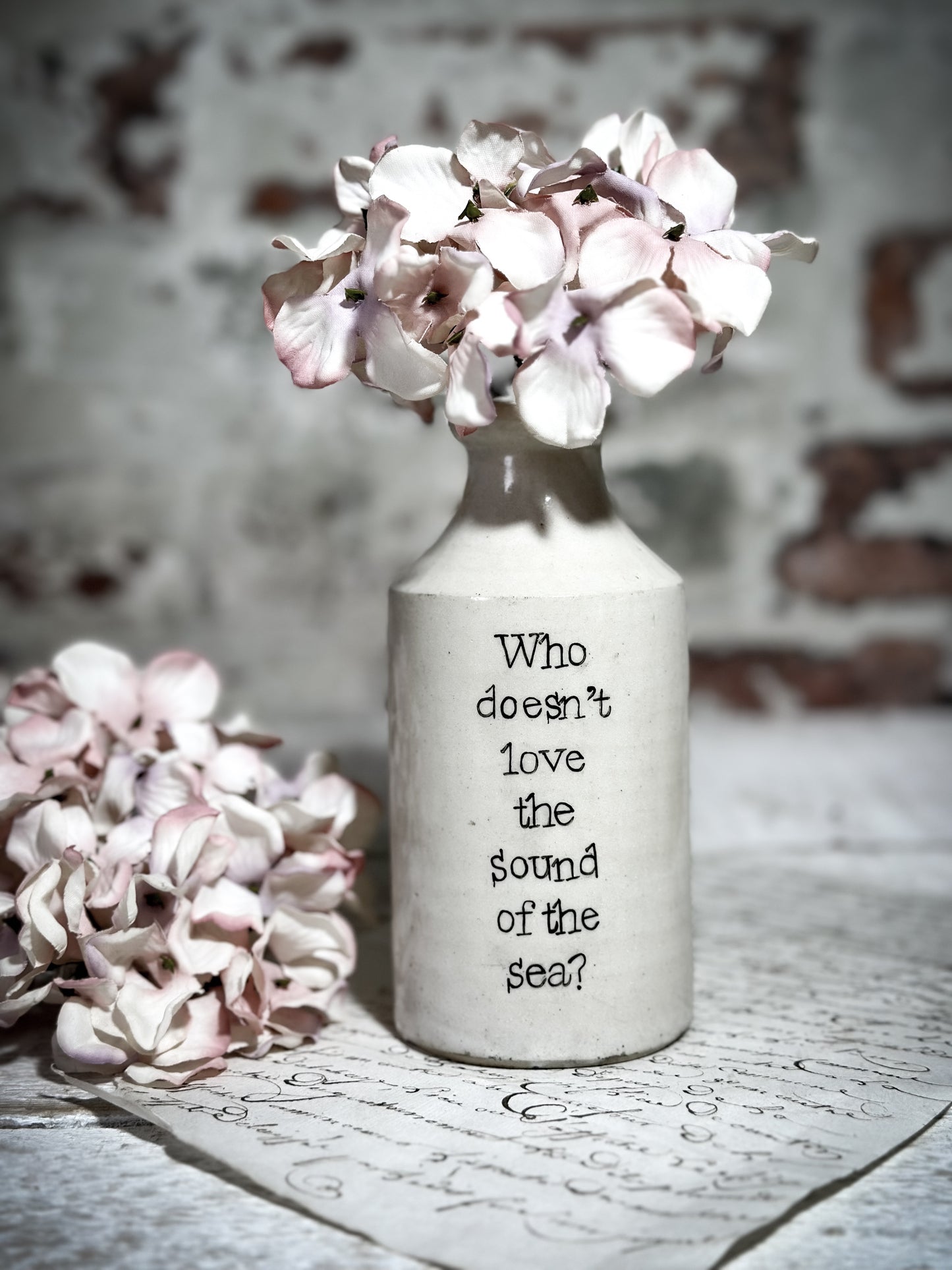 An Antique Pottery Bottle with a Hand Painted Inspirational Quote