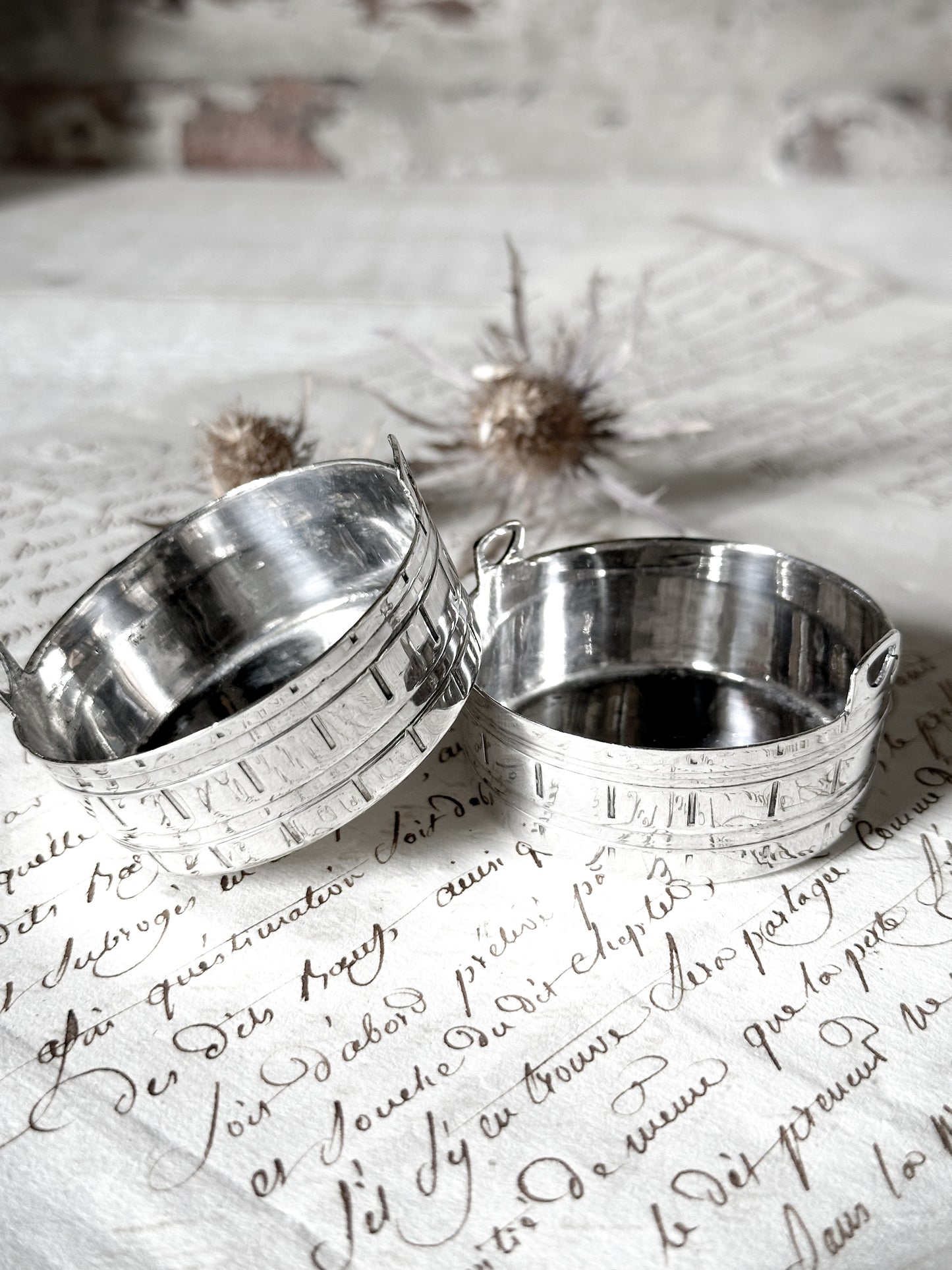 A pair of pretty silver plated mini churns