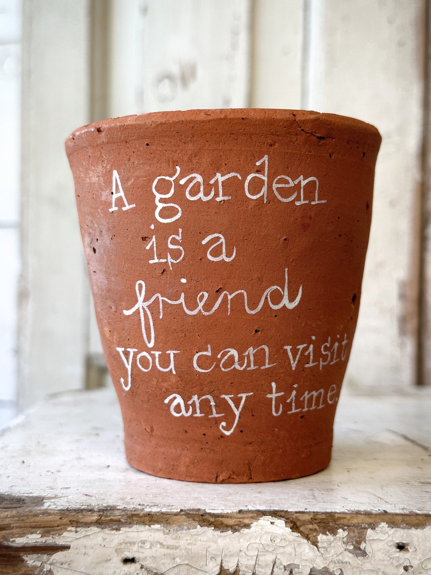 A Victorian terracotta pot with a quote