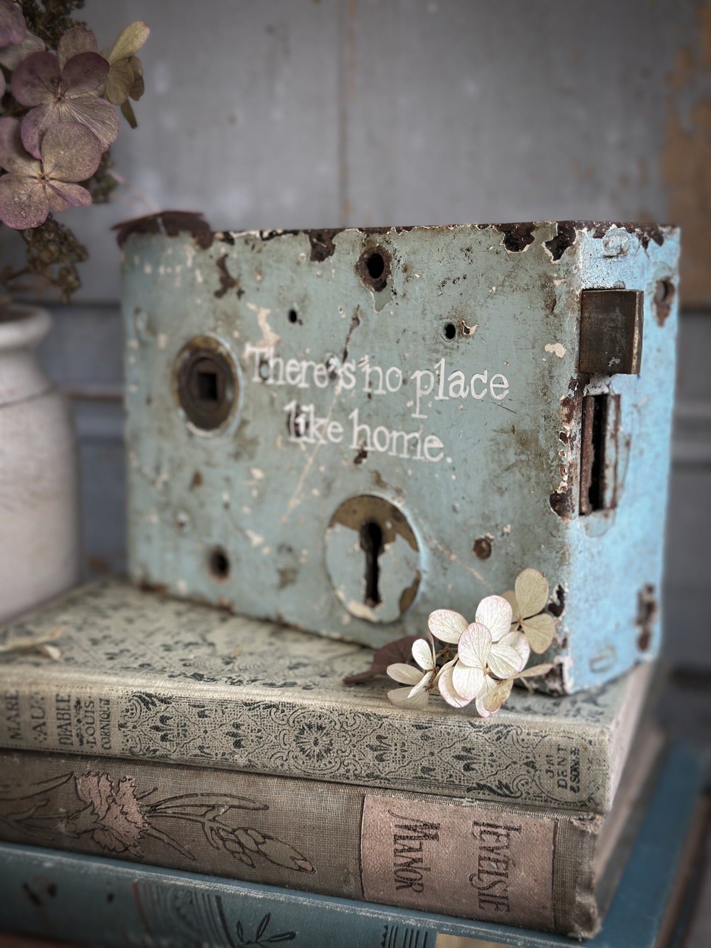 An Antique Lock With Hand Painted Quote