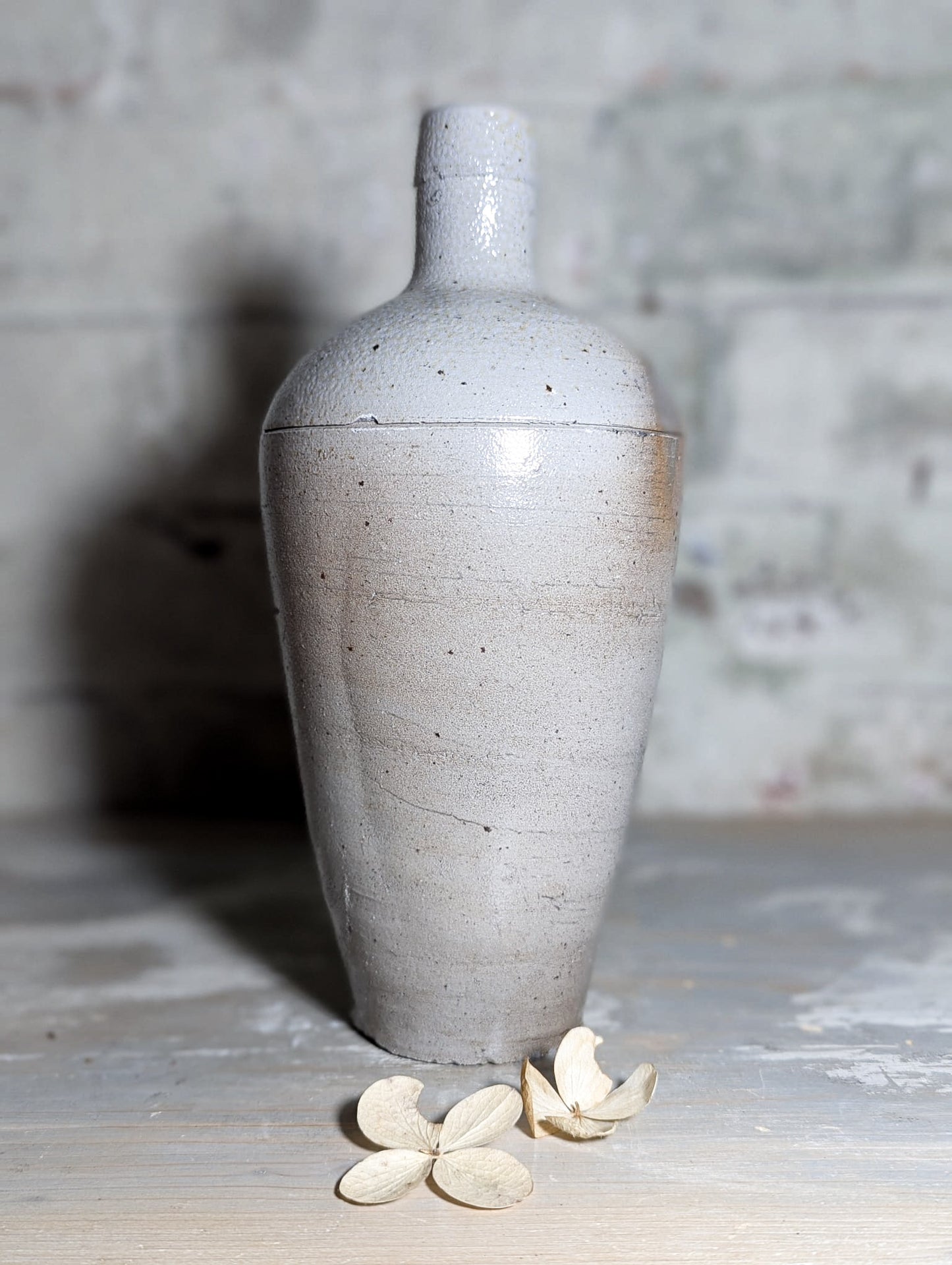 A lovely Primitive French Antique White Pottery bottle