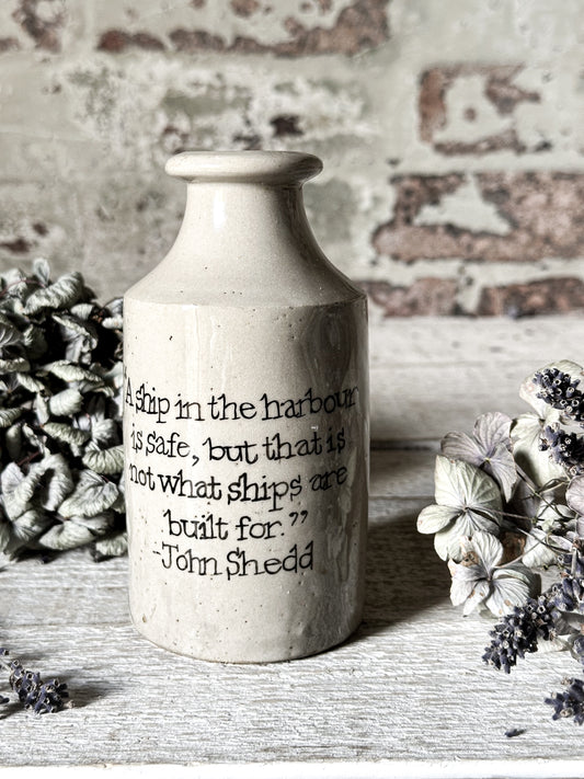 A Victorian unearthed stoneware pottery tall bottle with a hand painted quote