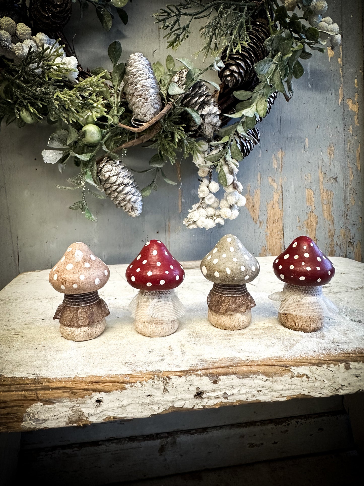 A wooden hand painted and trimmed Christmas village toadstool large pointy one