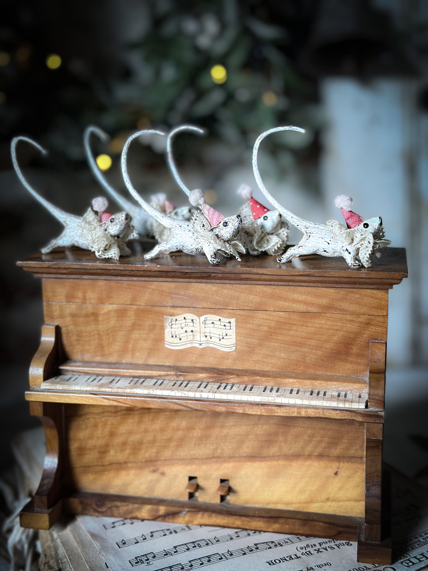 A cold painted brass “night before Christmas mouse” with a lace ruffle and Christmas hat