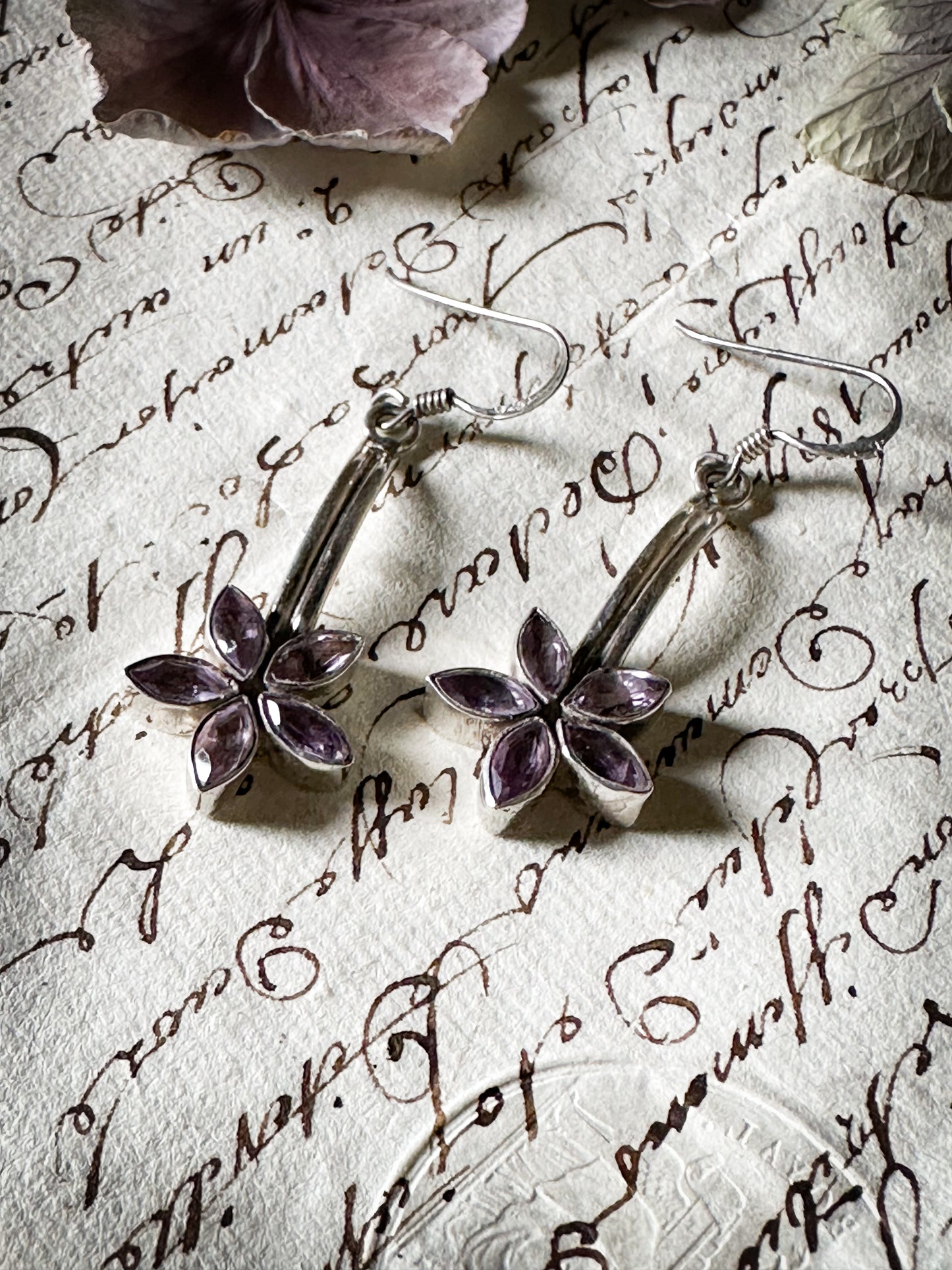 A pair of vintage silver amethyst flower drop earrings