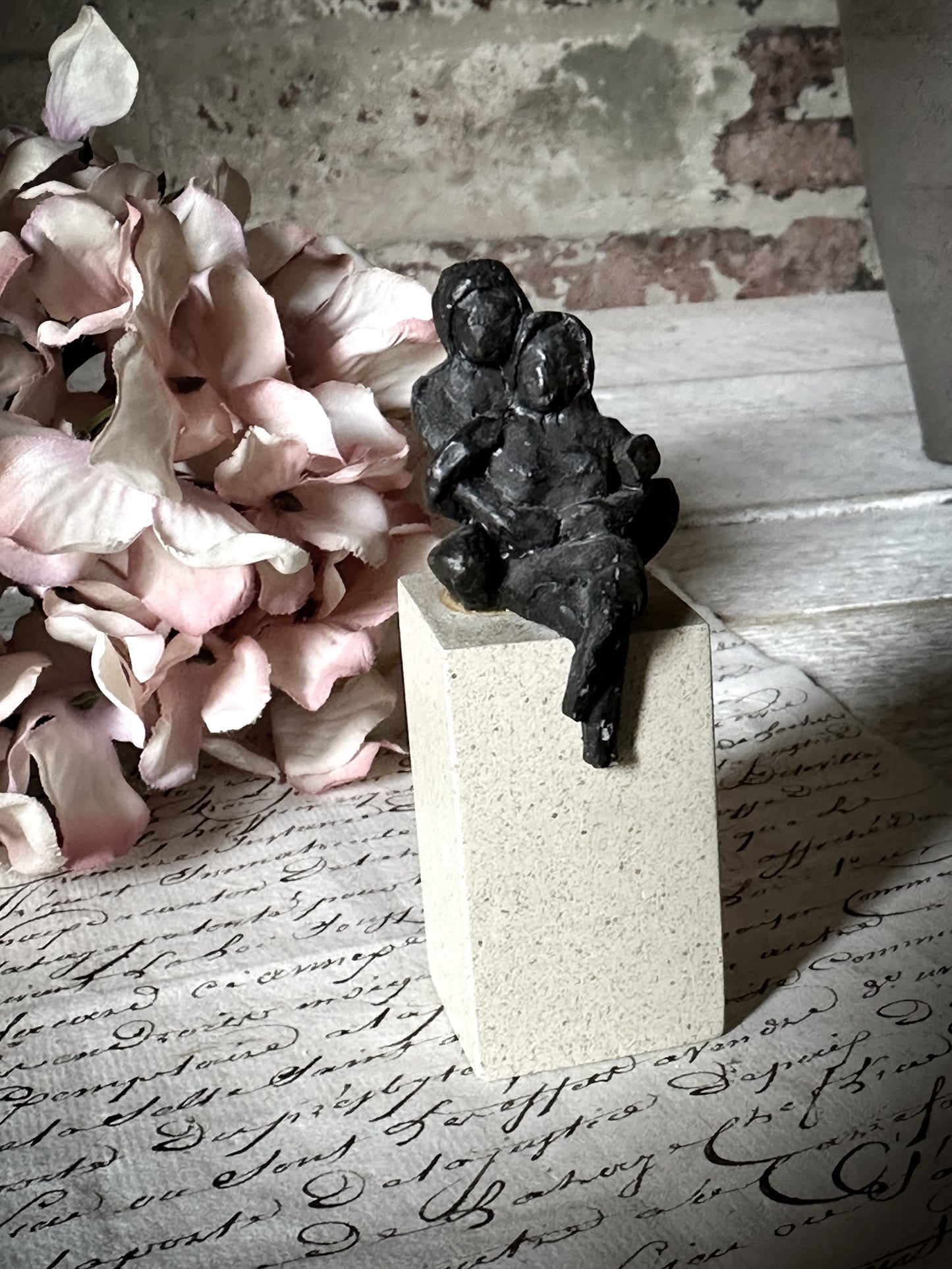 A Vintage Mini Sculpture of an Embracing Couple