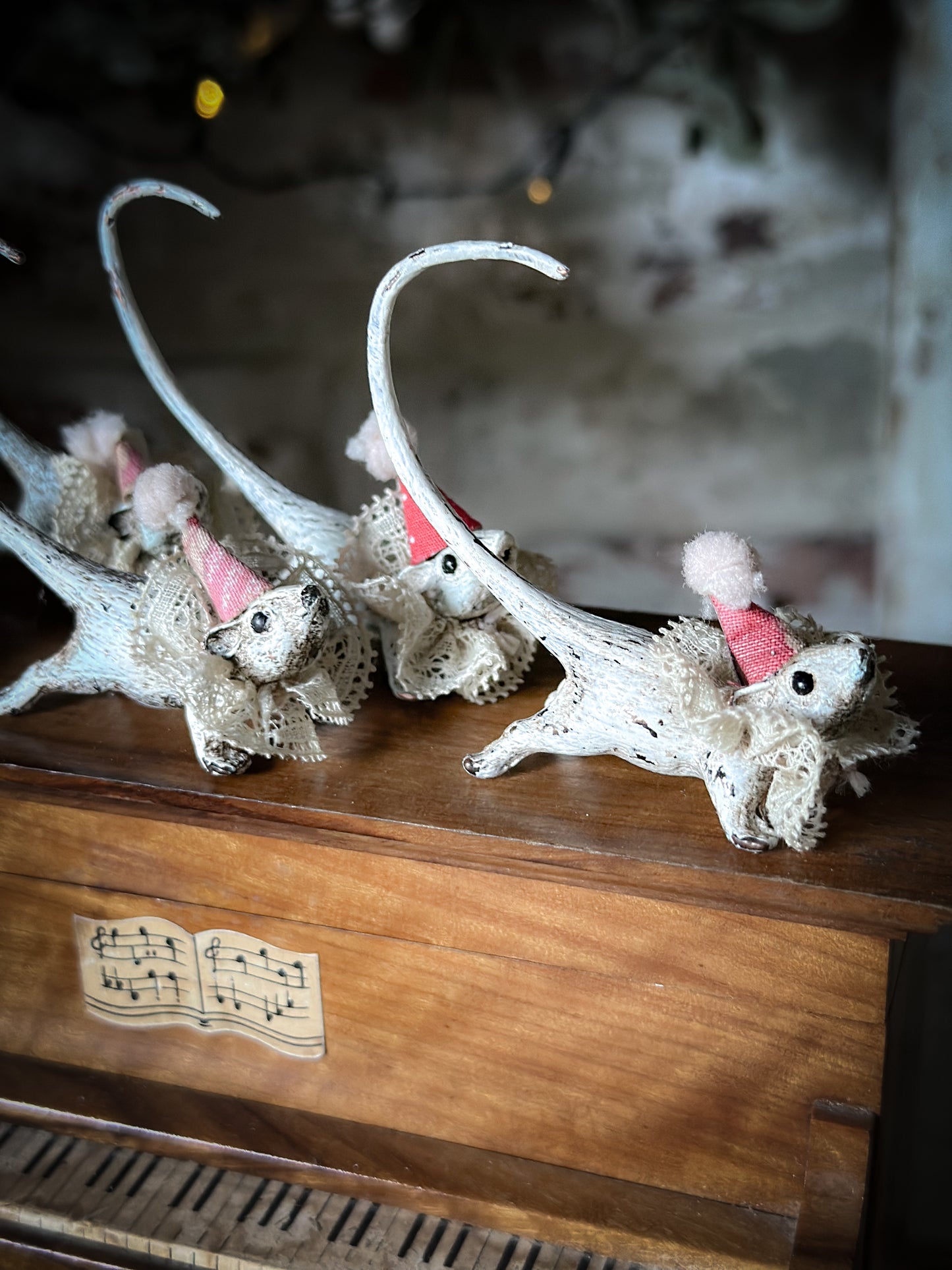 A cold painted brass “night before Christmas mouse” with a lace ruffle and Christmas hat