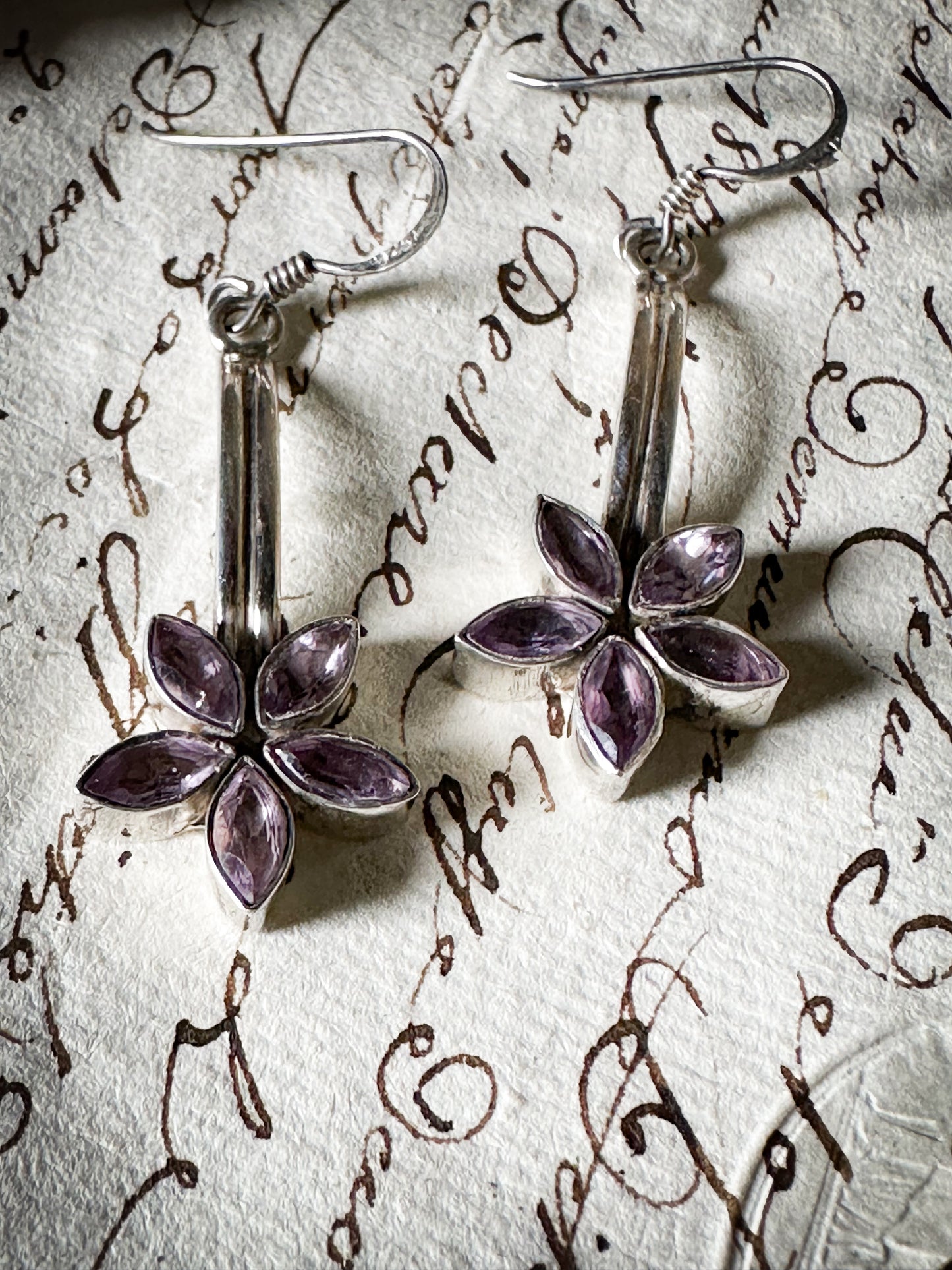 A pair of vintage silver amethyst flower drop earrings