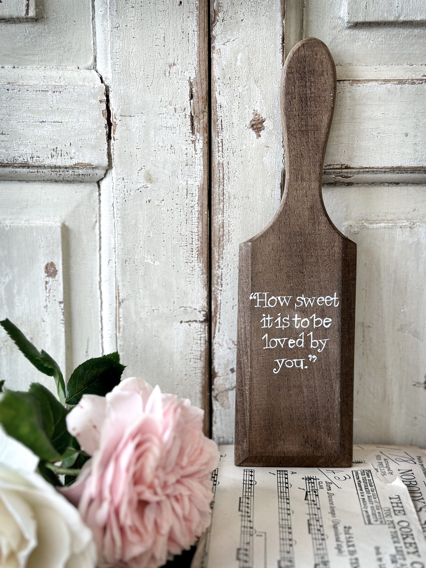 A hand painted vintage wooden butter pat “How sweet it is”