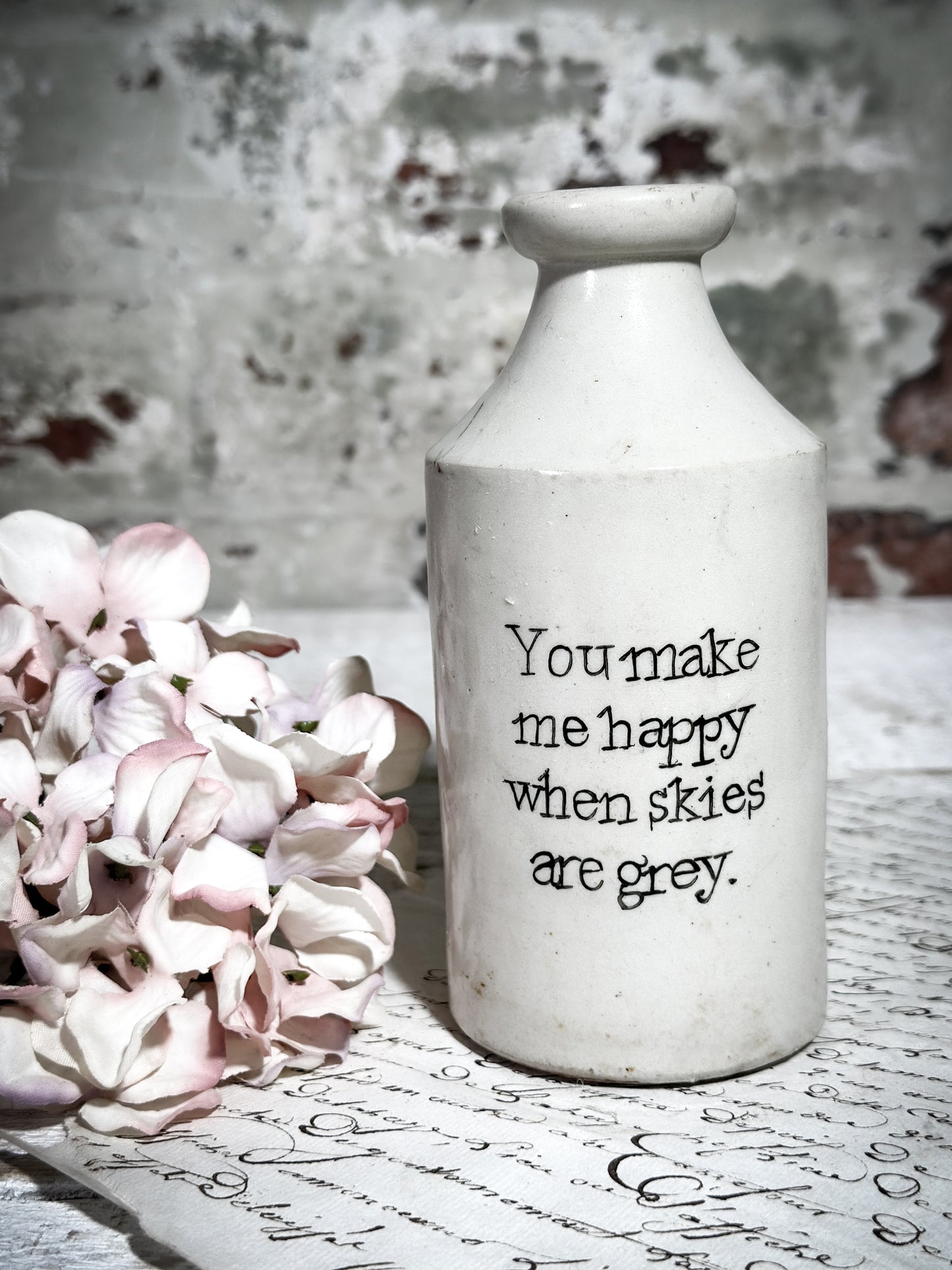 An Antique Pottery Bottle with a Hand Painted Valentine’s Day Quote