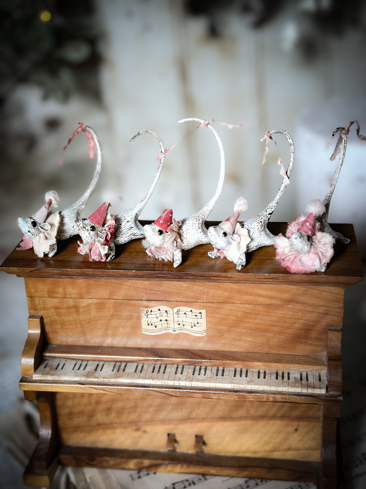 A cold painted brass “night before Christmas mouse” with a fabric ruffle and Christmas hat