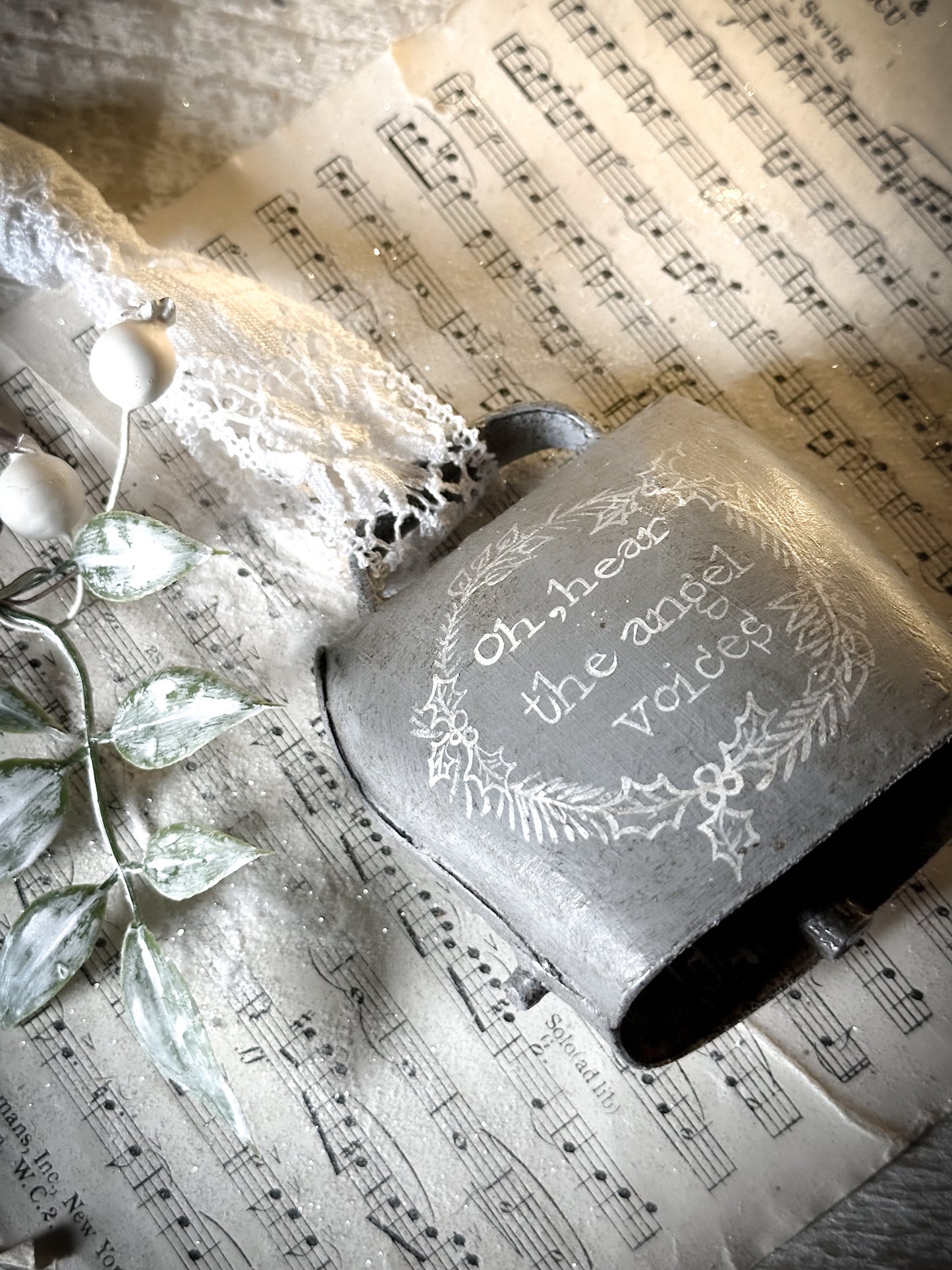 A vintage bell with a hand painted quote