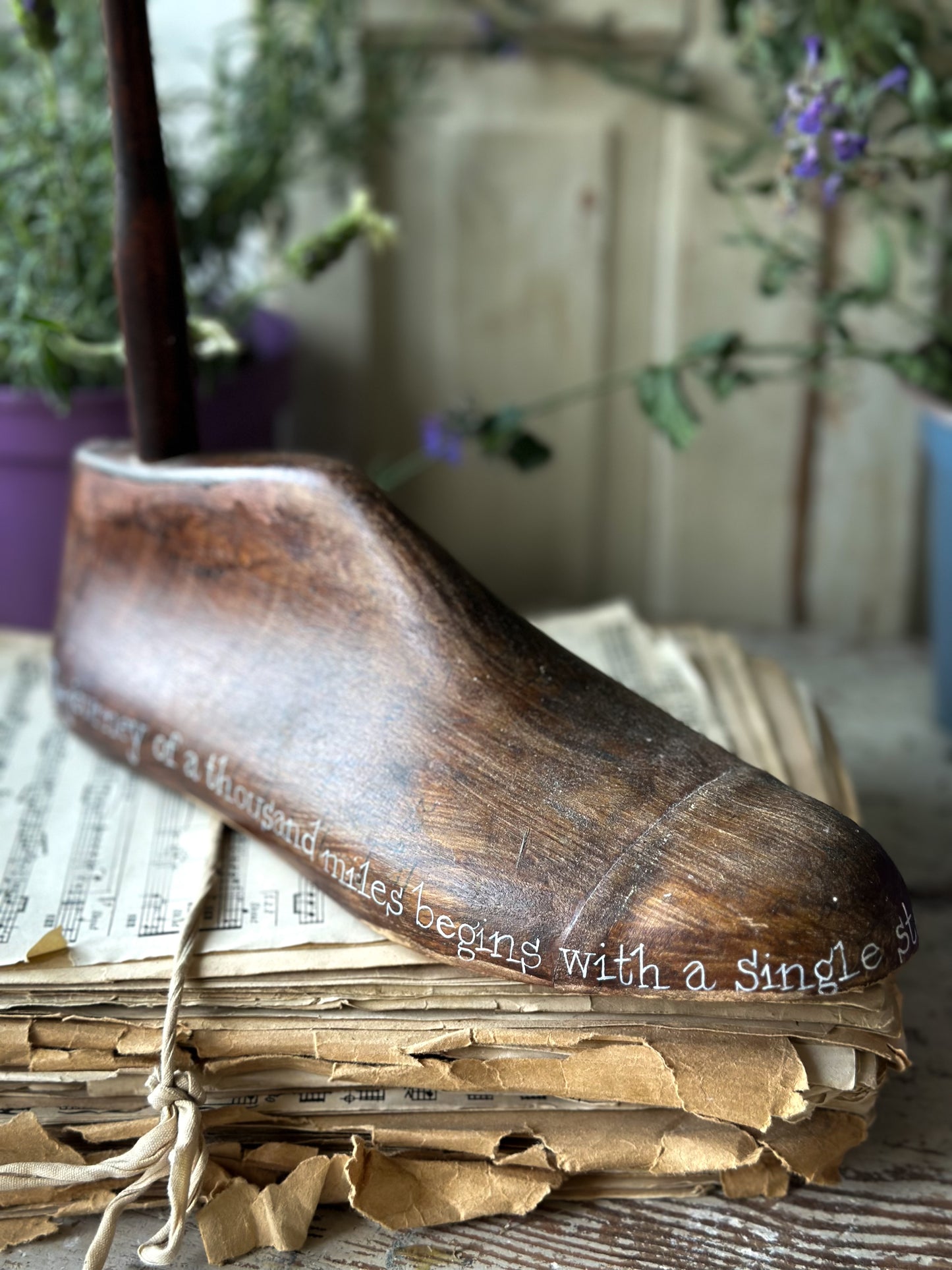 An antique wooden painted adult’s shoe last.