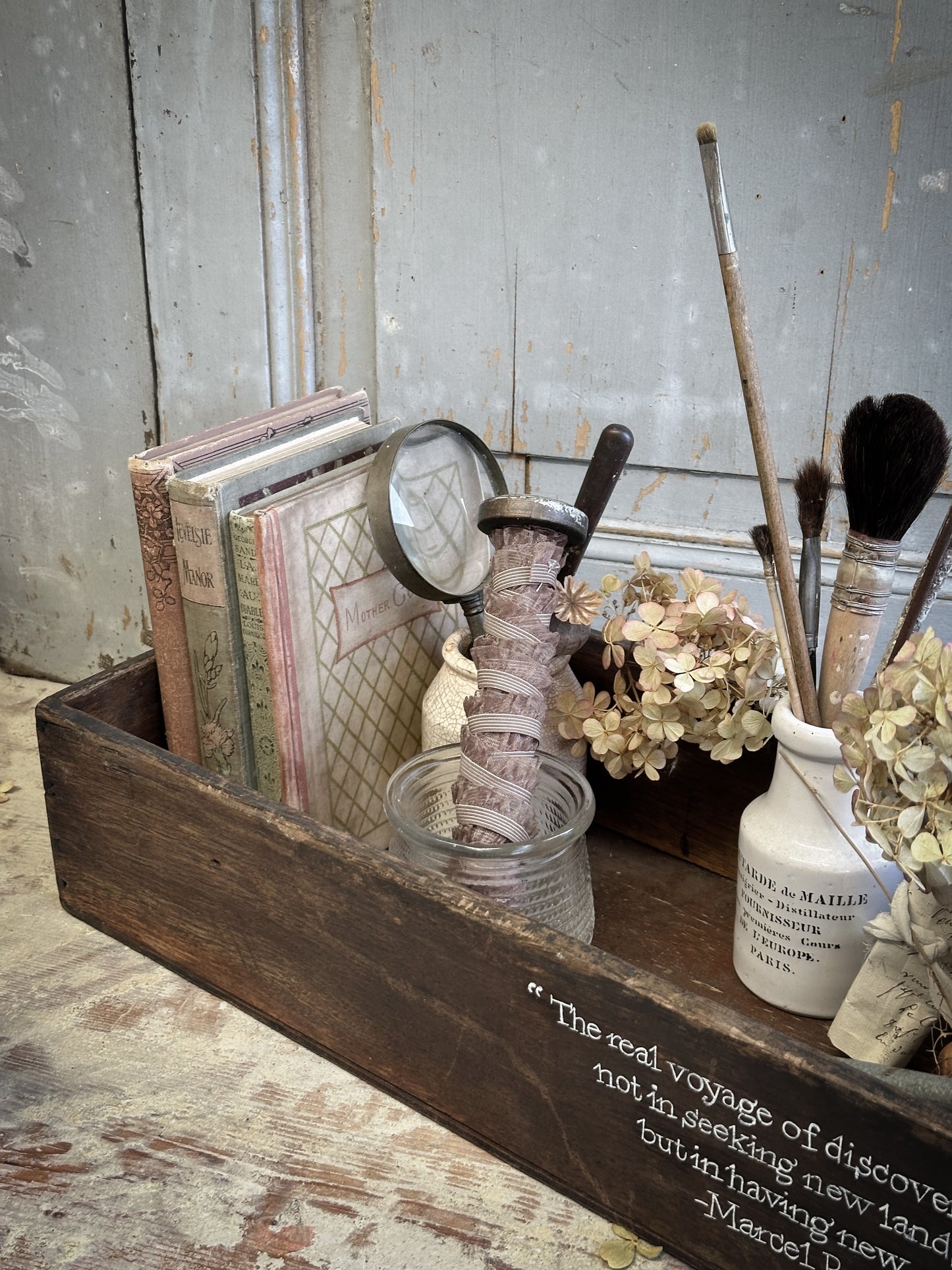 A Vintage Wooden Crate With Hand Painted Quote