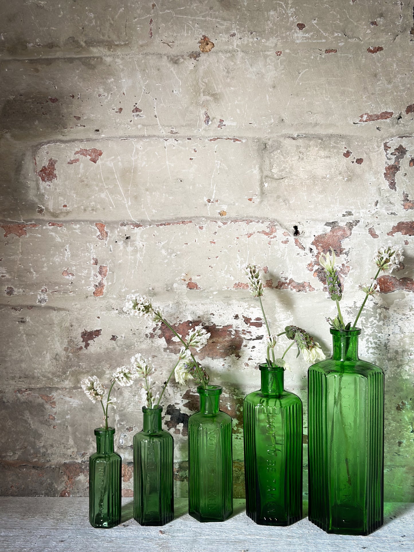 A set of Five lovely antique green poison bottles