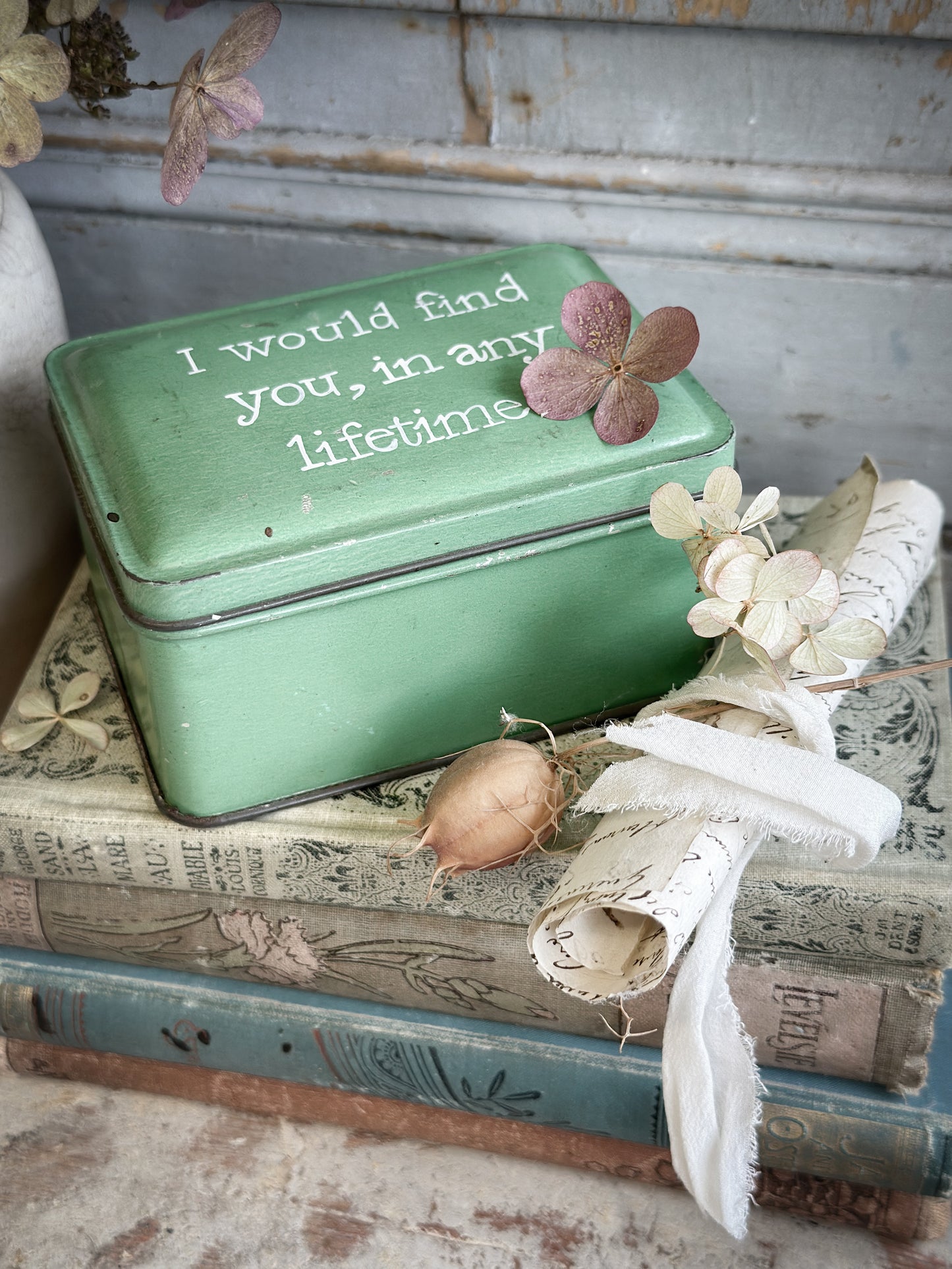 A Vintage Tin With A Hand Painted Quote
