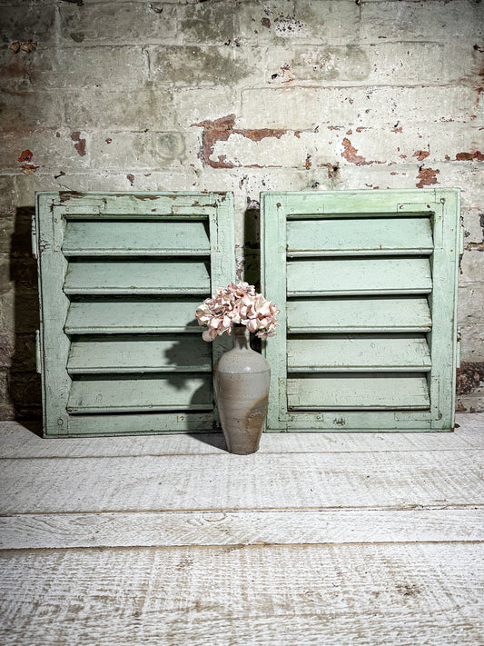 A Pair of French Green Chippy Painted Shutters