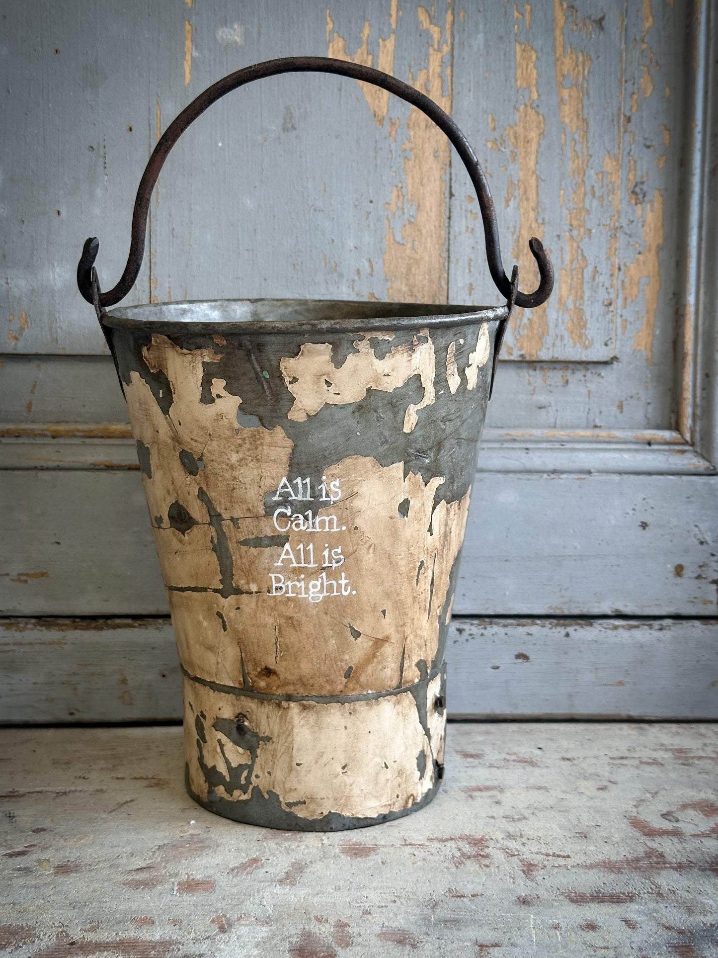 A Recycled Metal Mini Christmas Tree Bucket With A Hand Painted Quote