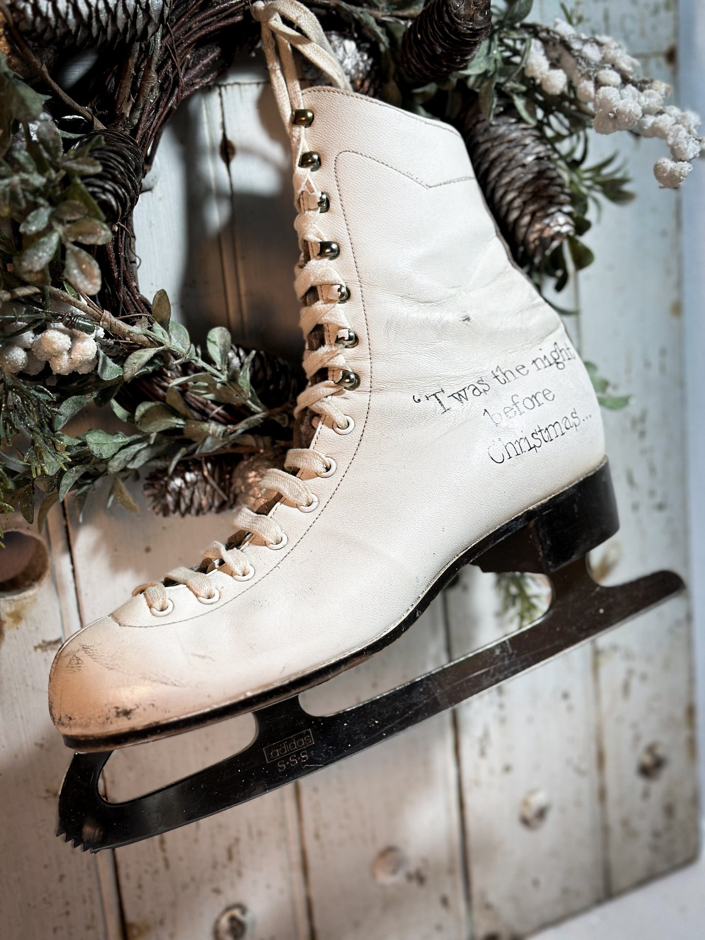 A beautiful vintage Christmas ice skate hand painted using traditional sign writer’s techniques and materials