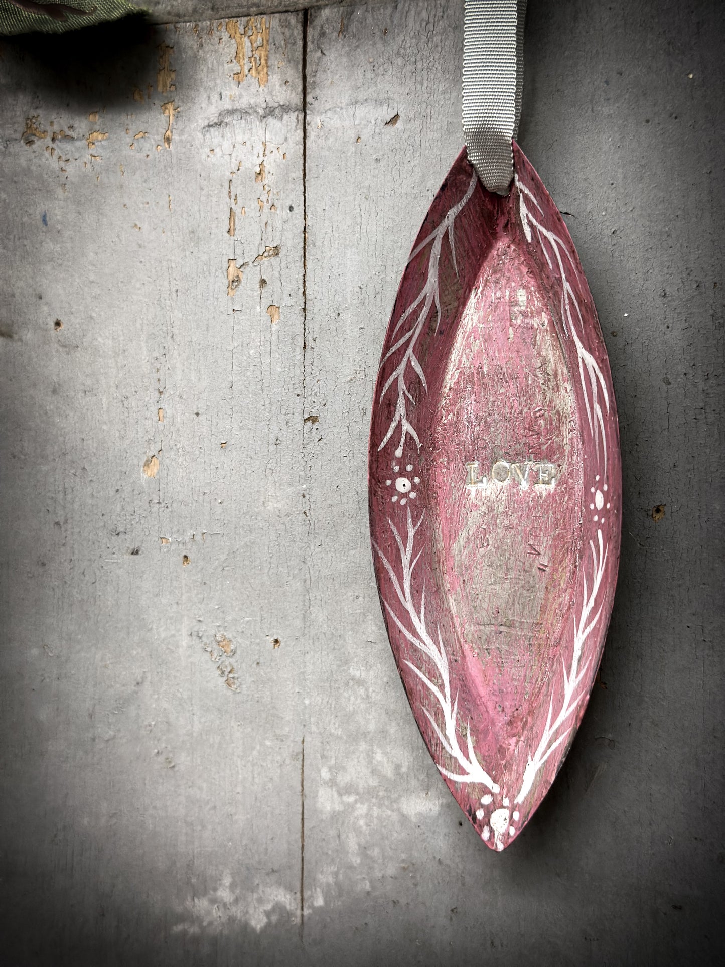 A Reworked French Patisserie Tin Christmas Decoration Stamped and Painted “love”