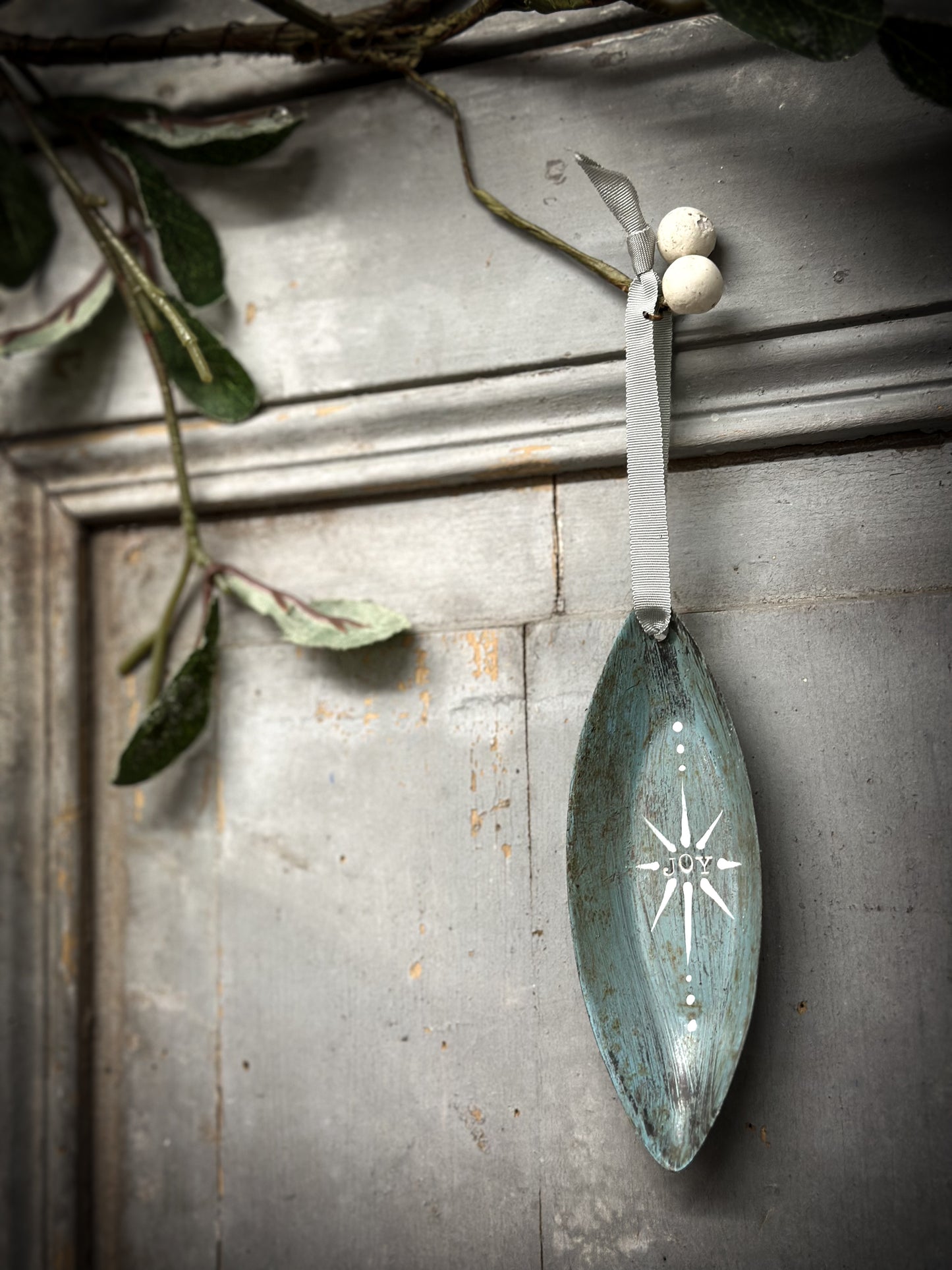 A Reworked French Patisserie Tin Christmas Decoration Stamped and Painted “Joy”