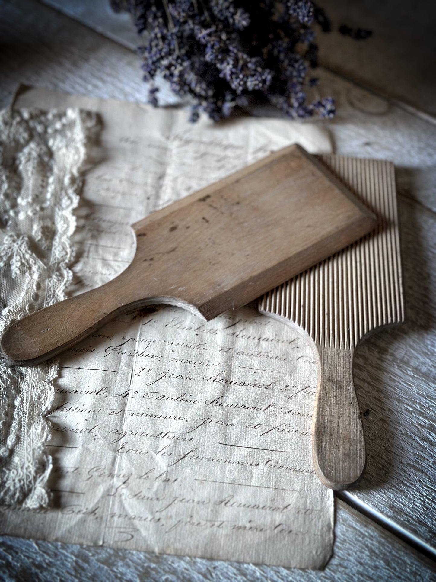 A pair of vintage primitive wooden butter pats