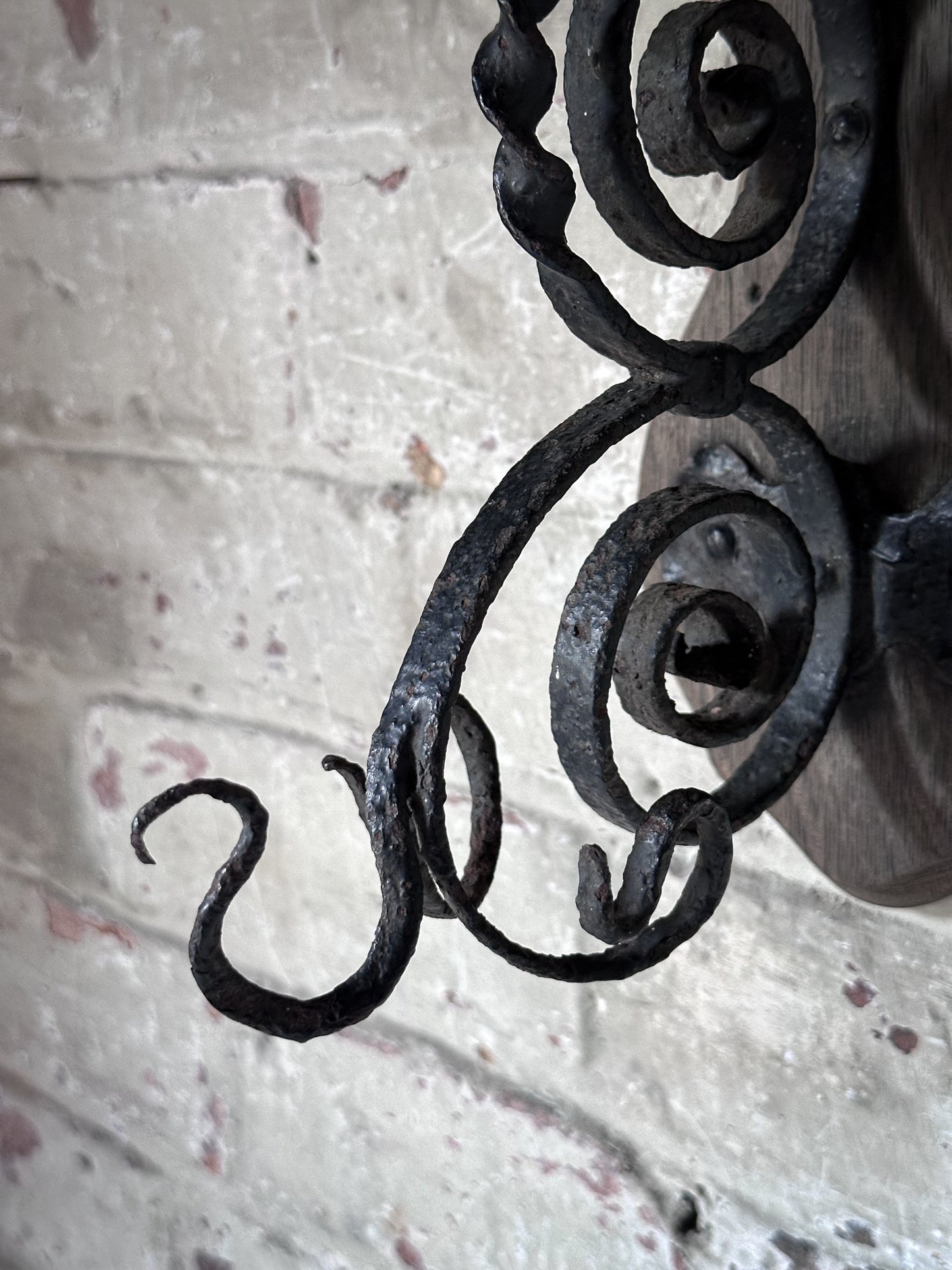Antique Hand-Forged Wrought Iron Wall Bracket | Folk Art Scrollwork Hook on Wooden Backplate
