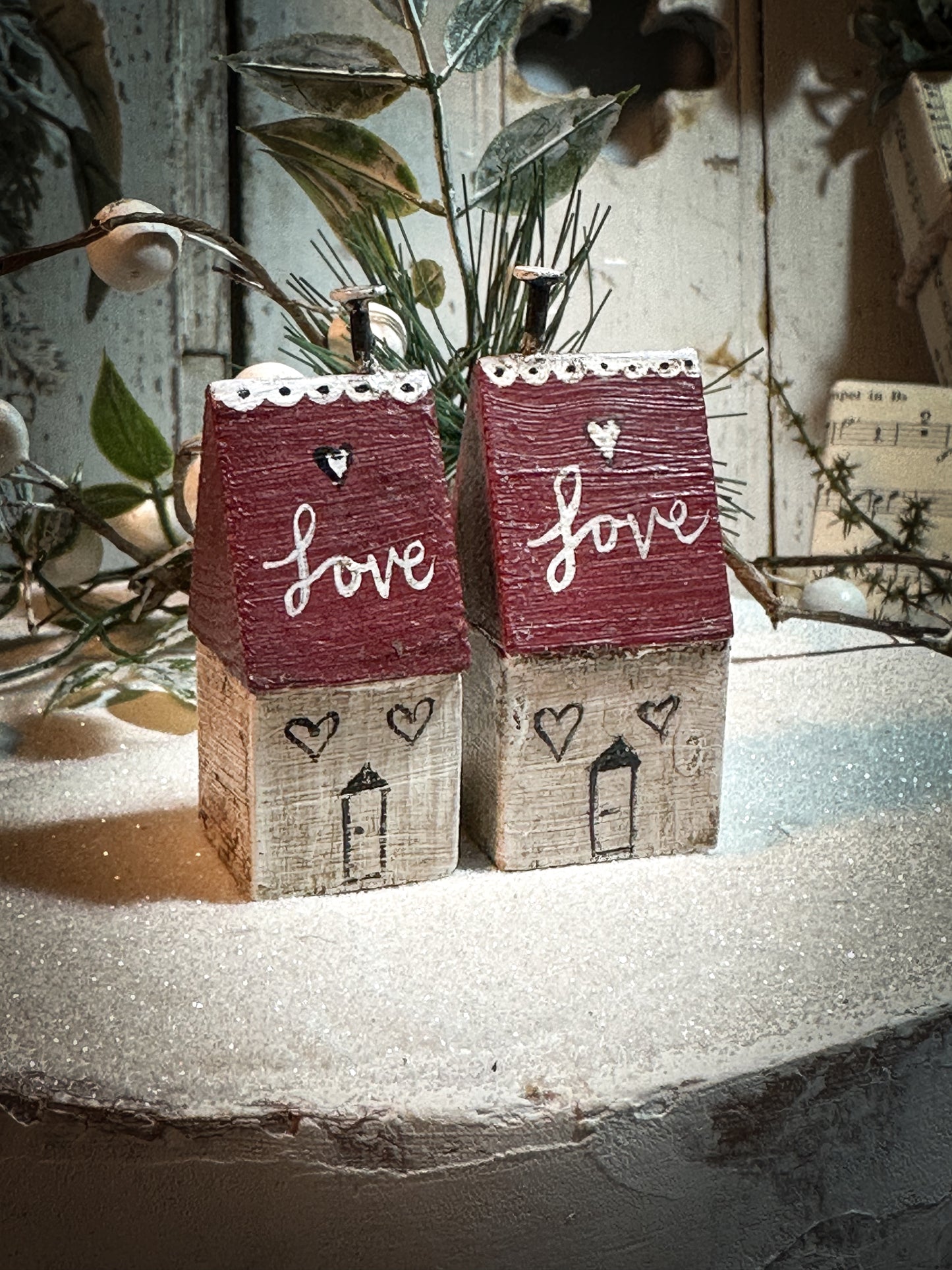 A pretty vintage German Erzgebirge Putz wooden village house painted with a Christmas quote