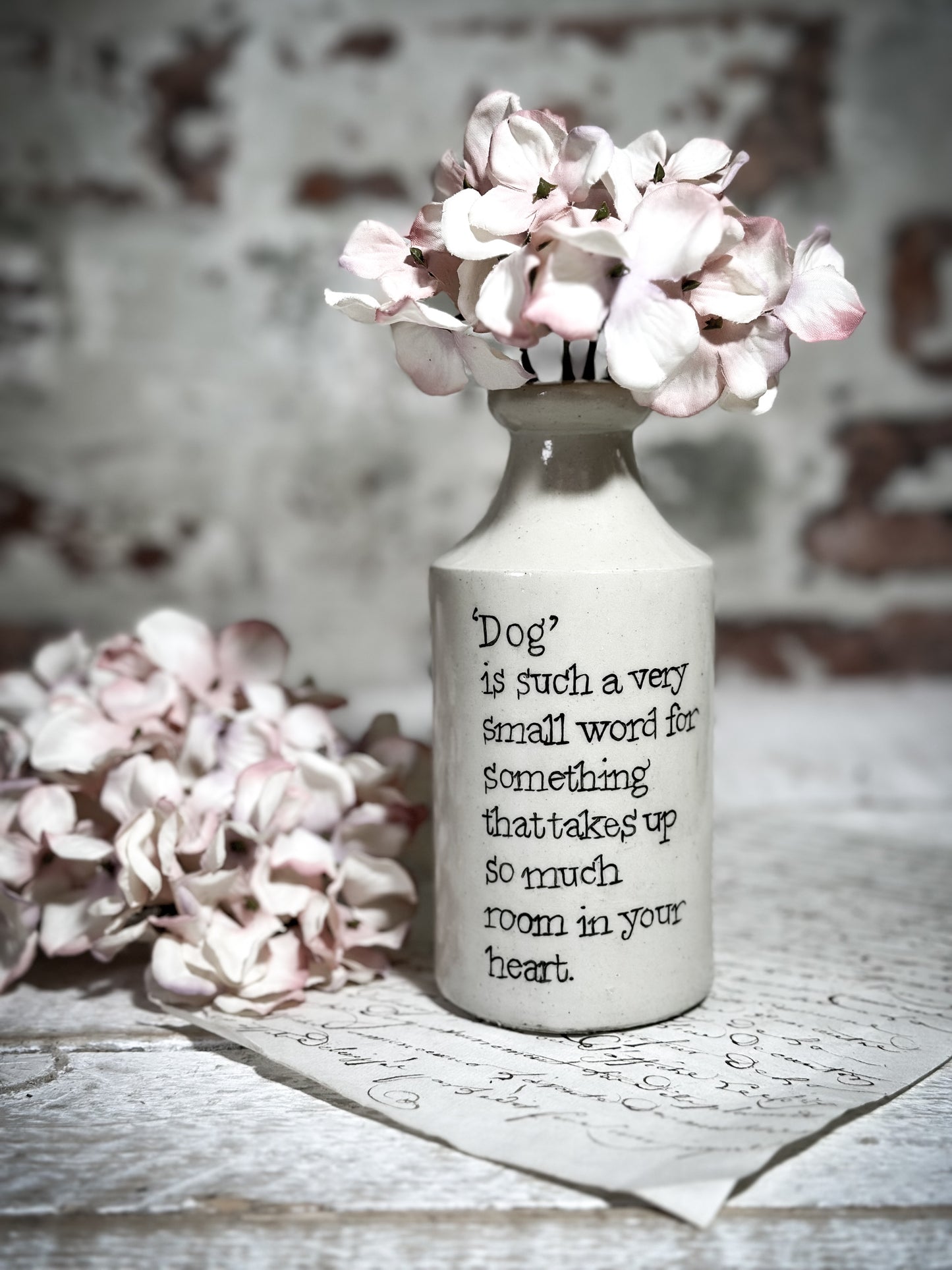 An Antique Pottery Bottle with a Hand Painted Inspirational Quote