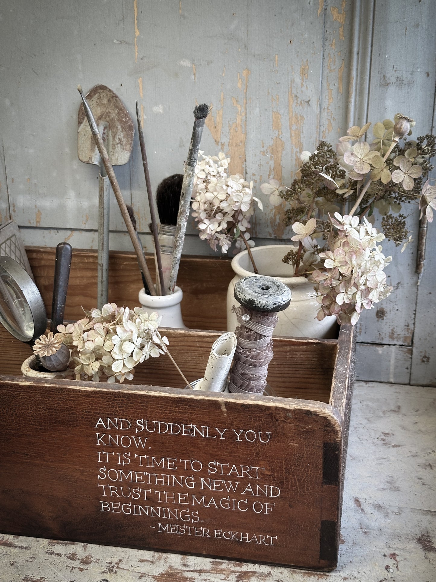 A Vintage Wooden Drawer With Hand Painted Quote
