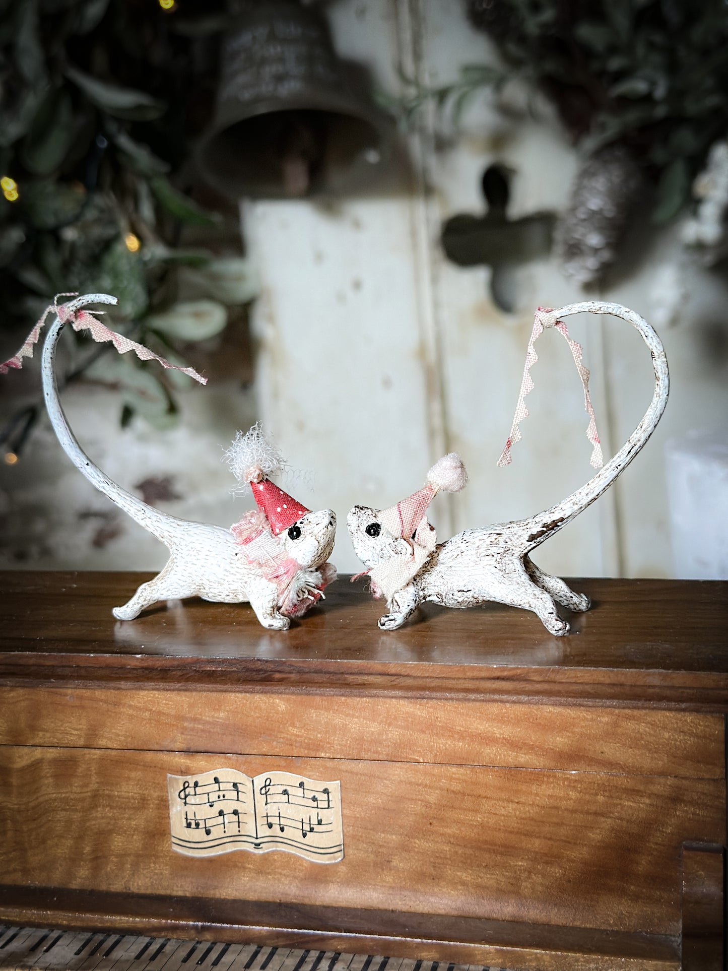 A cold painted brass “night before Christmas mouse” with a fabric ruffle and Christmas hat