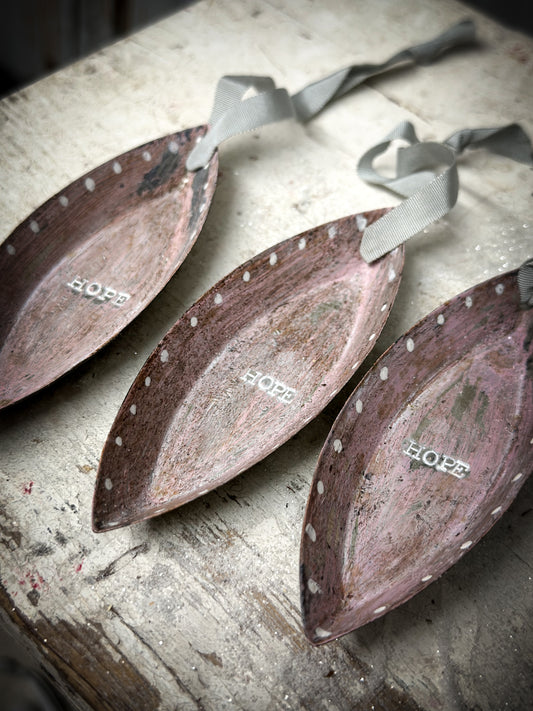 A Reworked French Patisserie Tin Christmas Decoration Stamped and Painted “Hope”