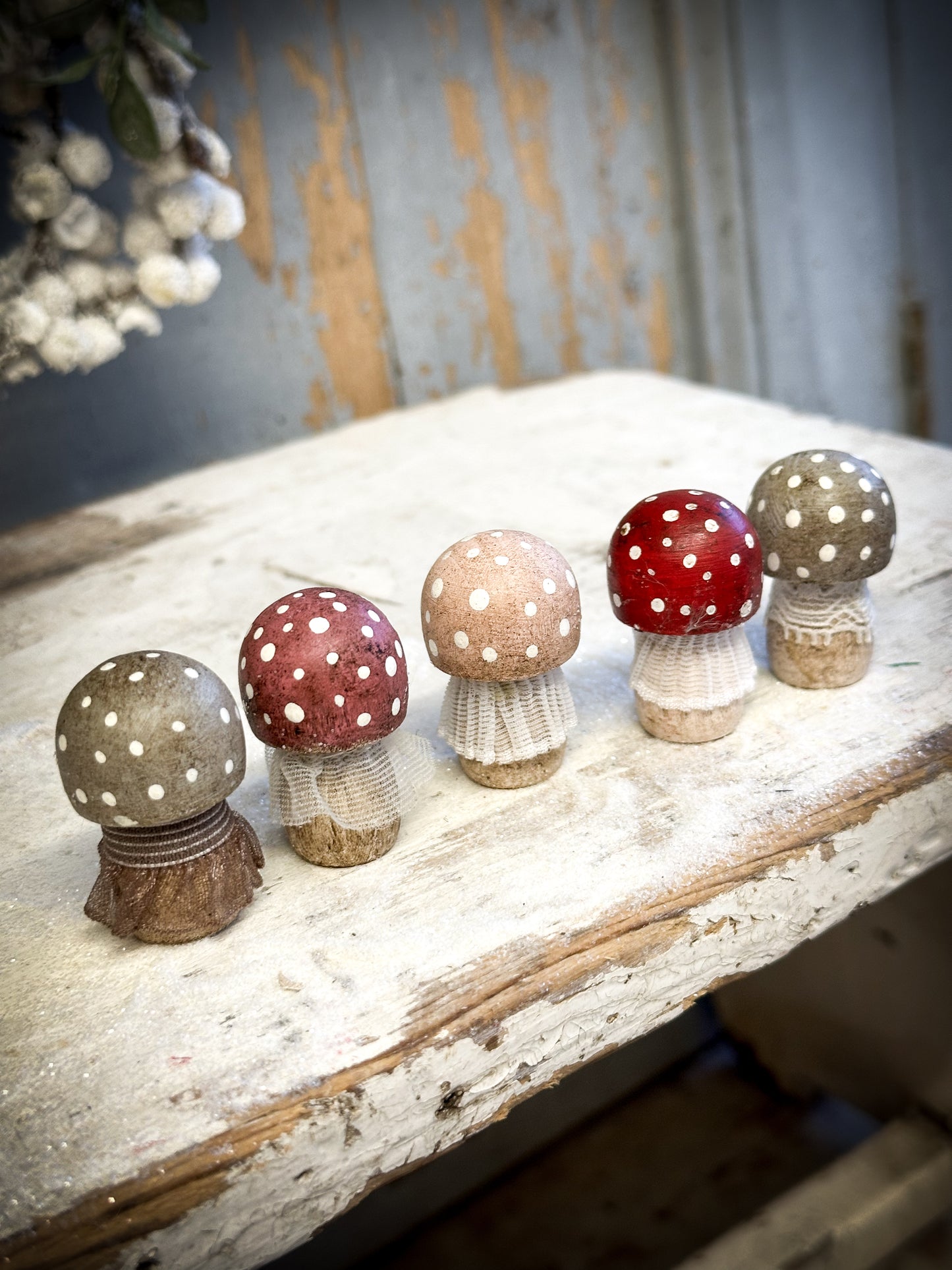 A wooden hand painted and trimmed Christmas village toadstool large capped one