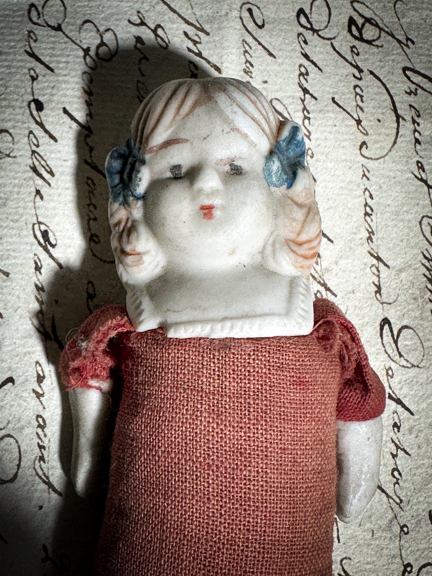 A vintage bisque head and shoulder doll