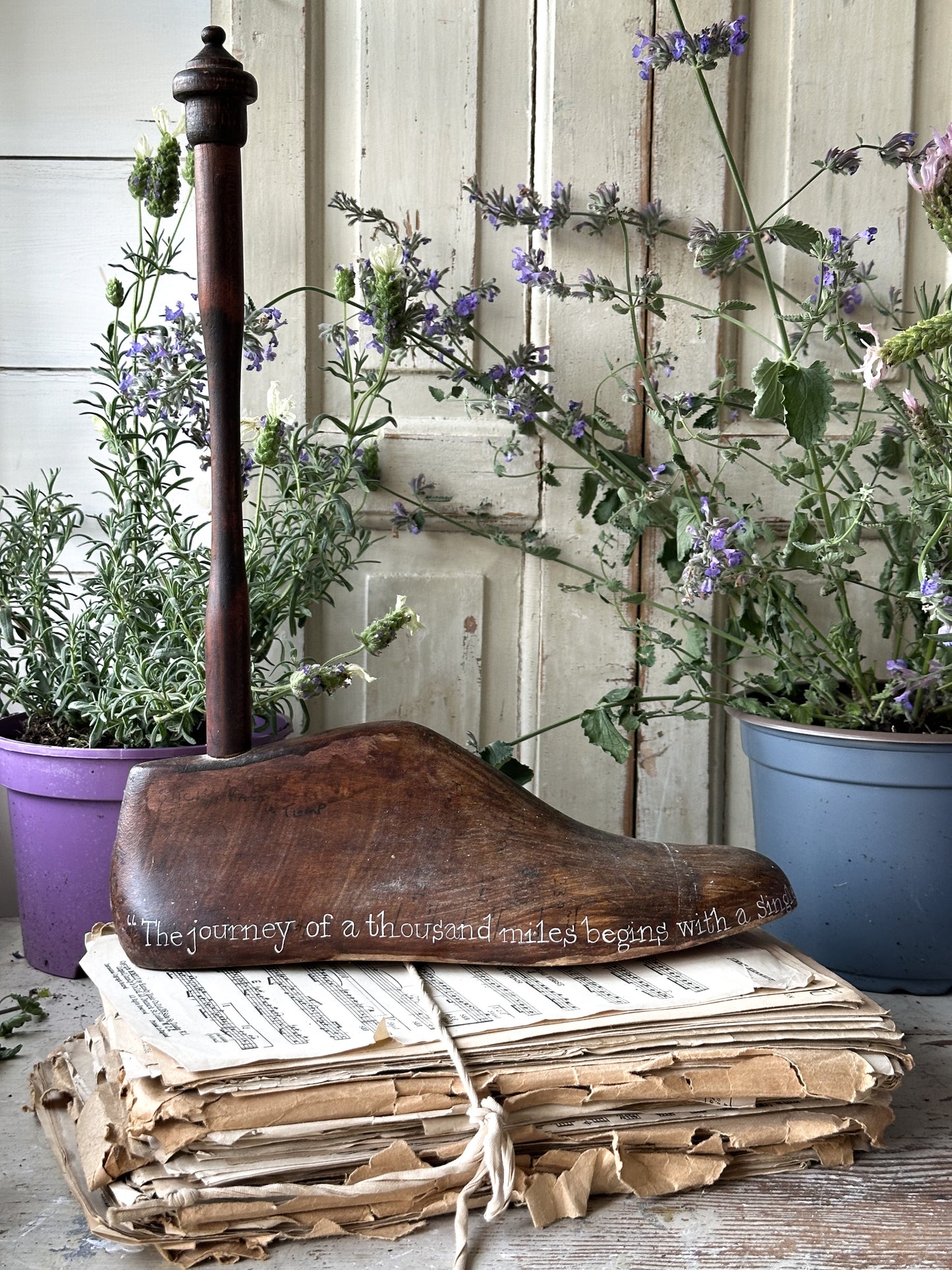 An antique wooden painted adult’s shoe last.