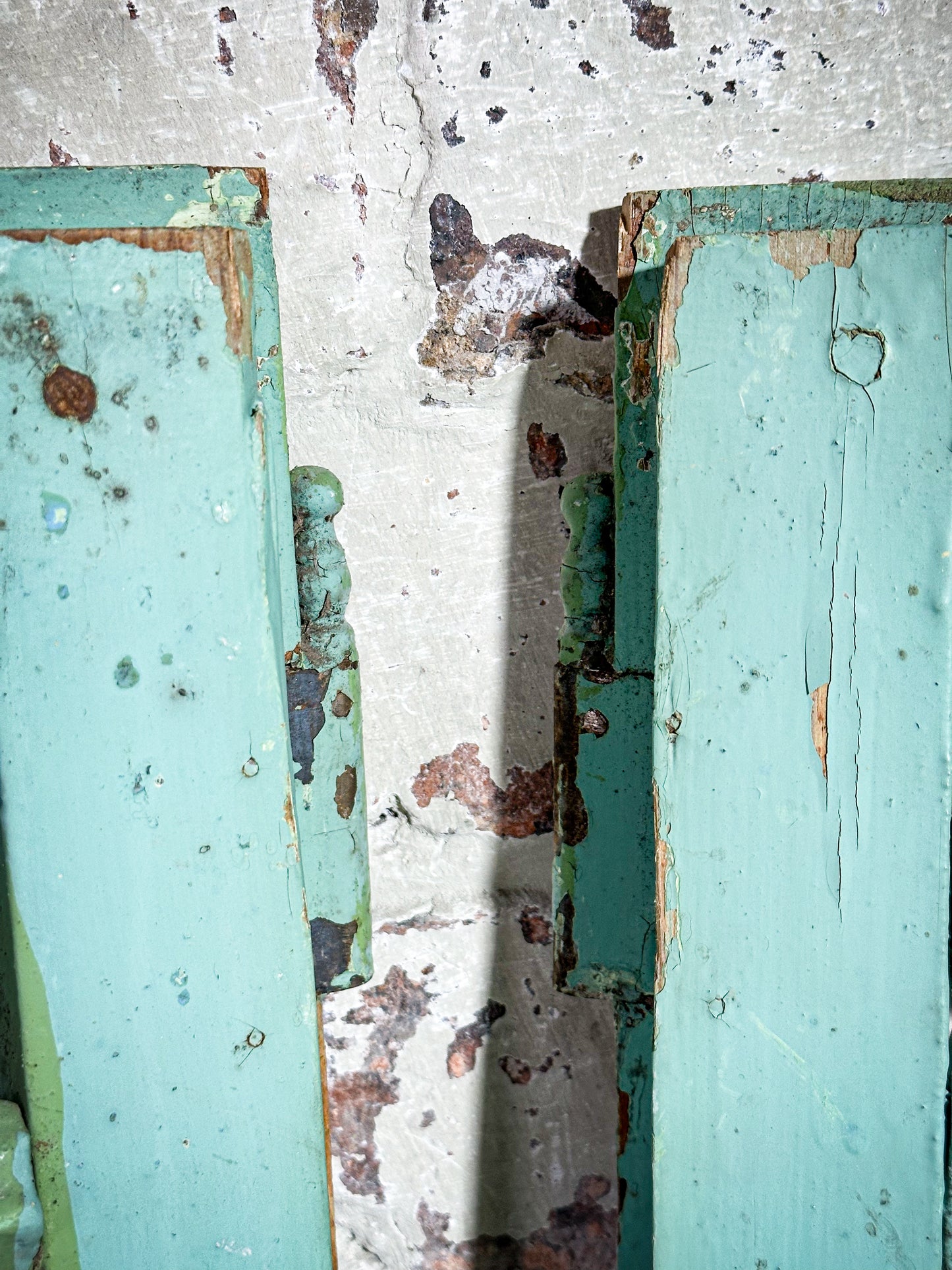 A Pair of French Green Chippy Painted Shutters