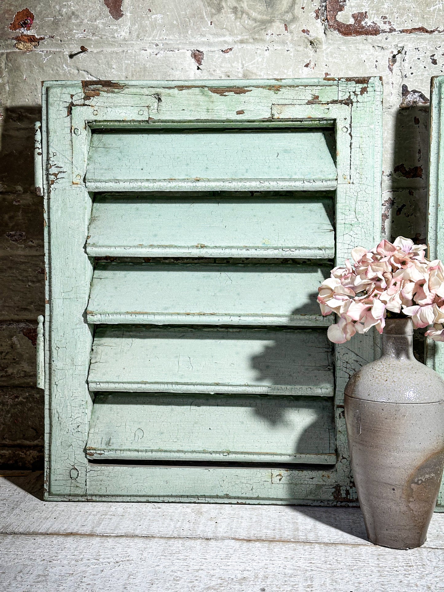 A Pair of French Green Chippy Painted Shutters