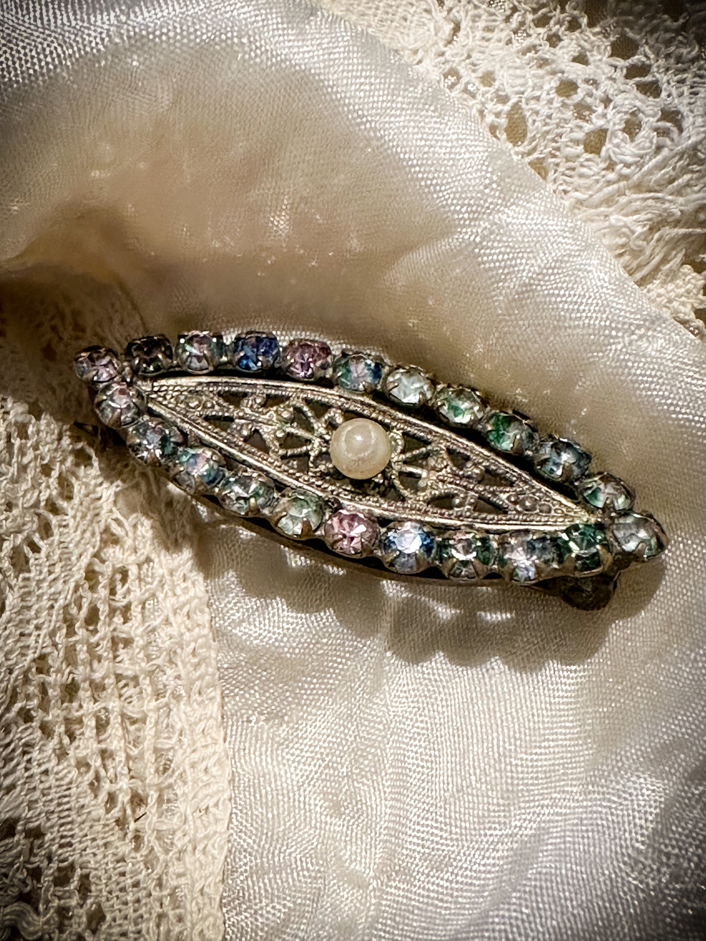 A stunning Iris glass oval sweetheart brooch