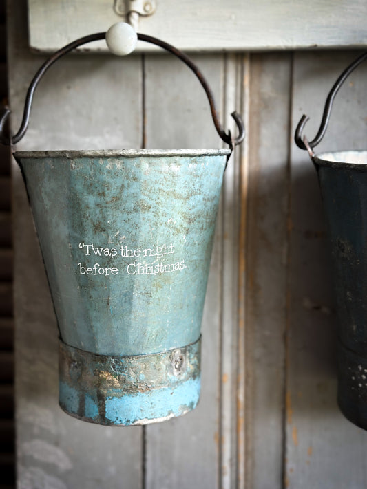 A Recycled Metal Mini Christmas Tree Bucket With A Hand Painted Quote