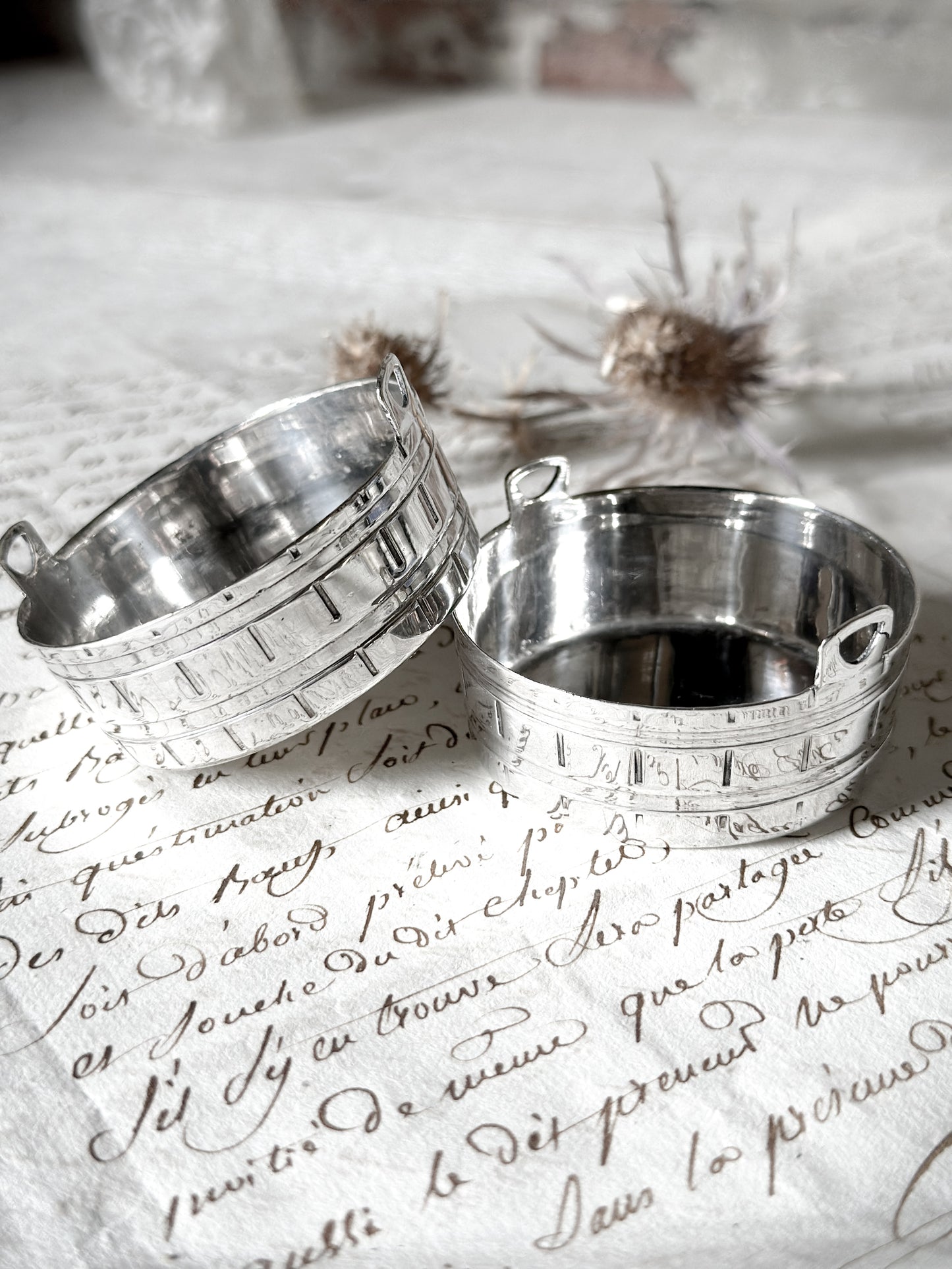 A pair of pretty silver plated mini churns