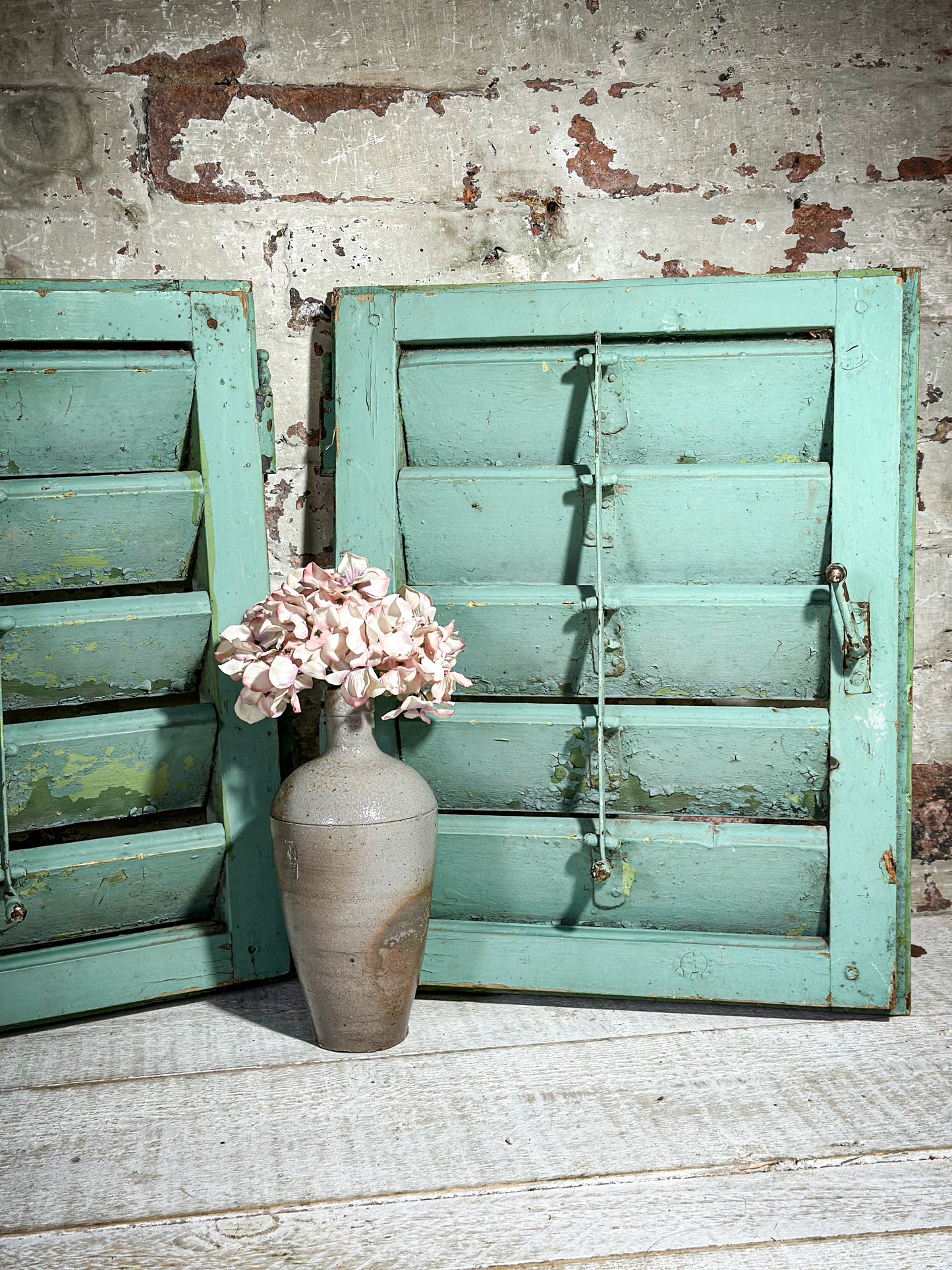 A Pair of French Green Chippy Painted Shutters